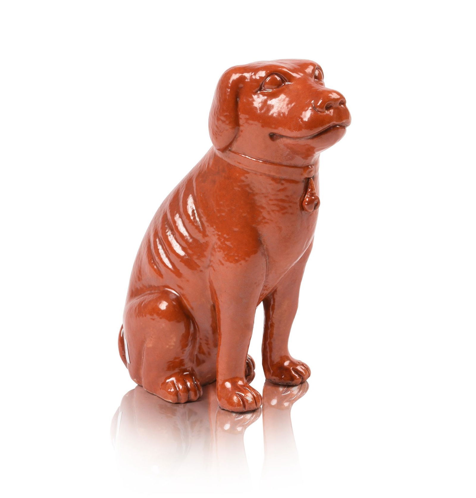 Chinese Coral Ground Porcelain Dog Statue.: Late 19th/early 20th c. Height 6.125 inches.