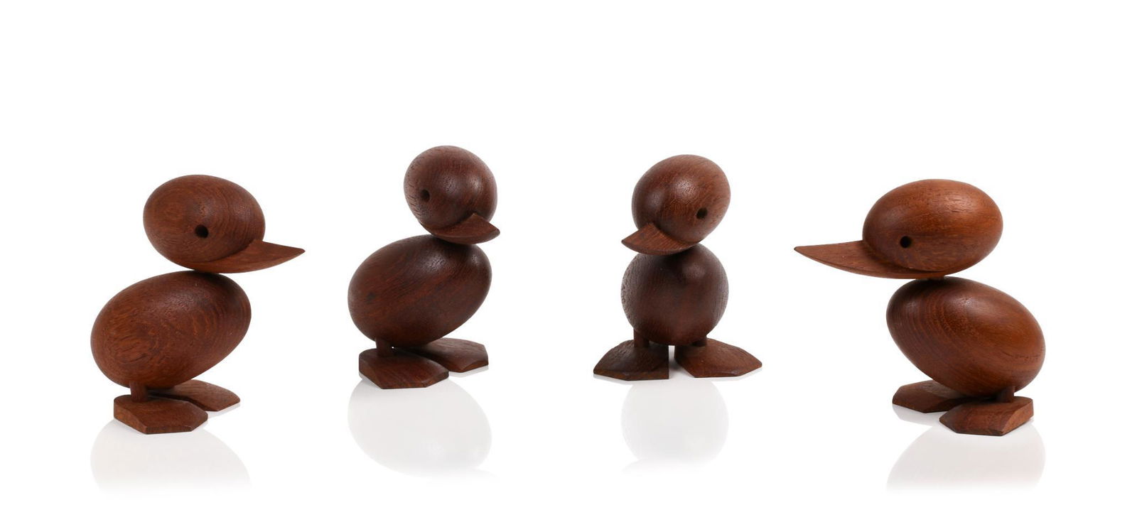 Four Hans Bolling Danish Teak Ducks: Height 3.5 inches.