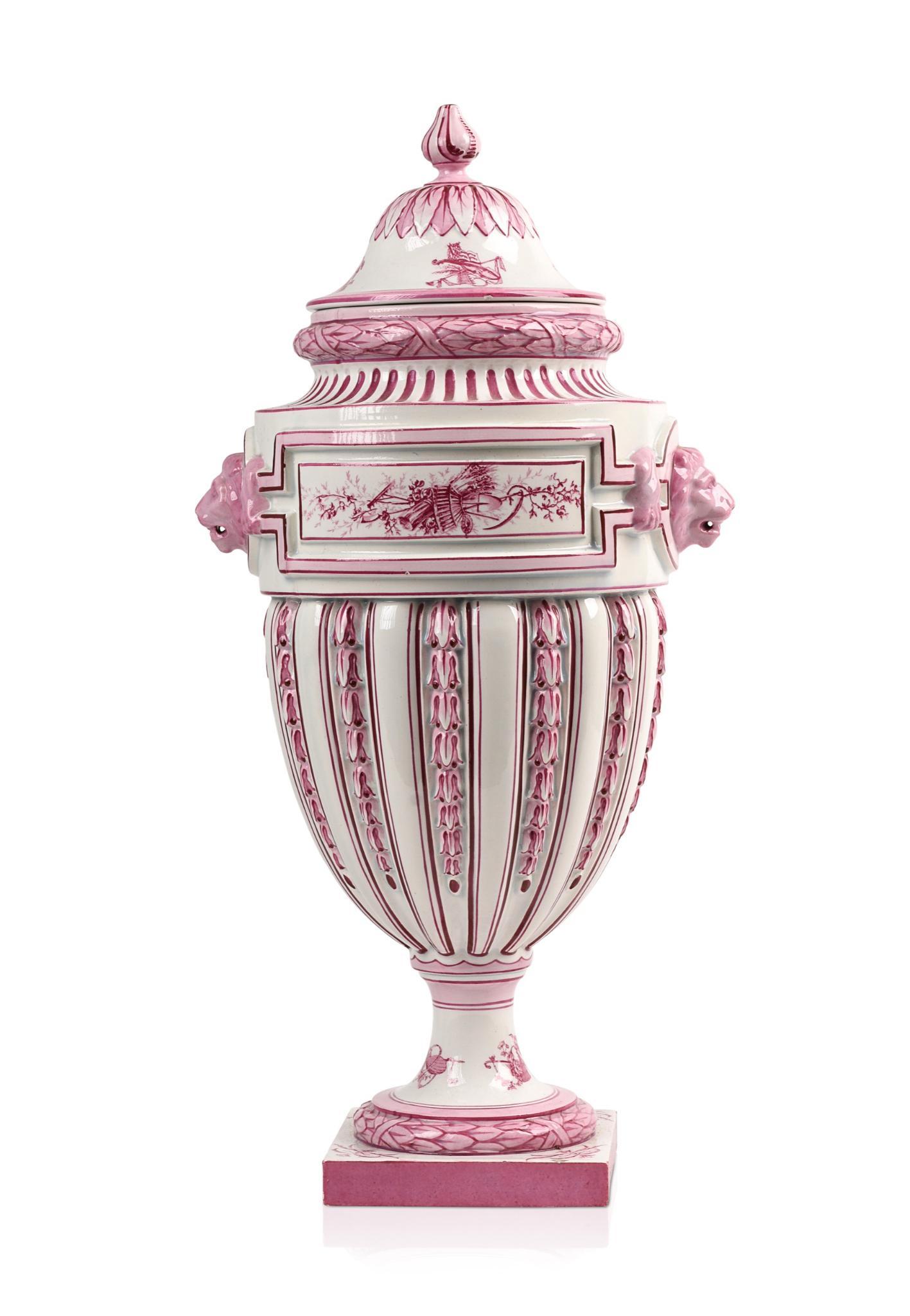 Large Gien Faience Neoclassical Covered Urn.: Creamware with pink highlights, hand painted decoration including cartouches with agricultural subjects, lion handles, France c. 1870â€™s, signed with Gien castle mark. Height 19.5 inches.