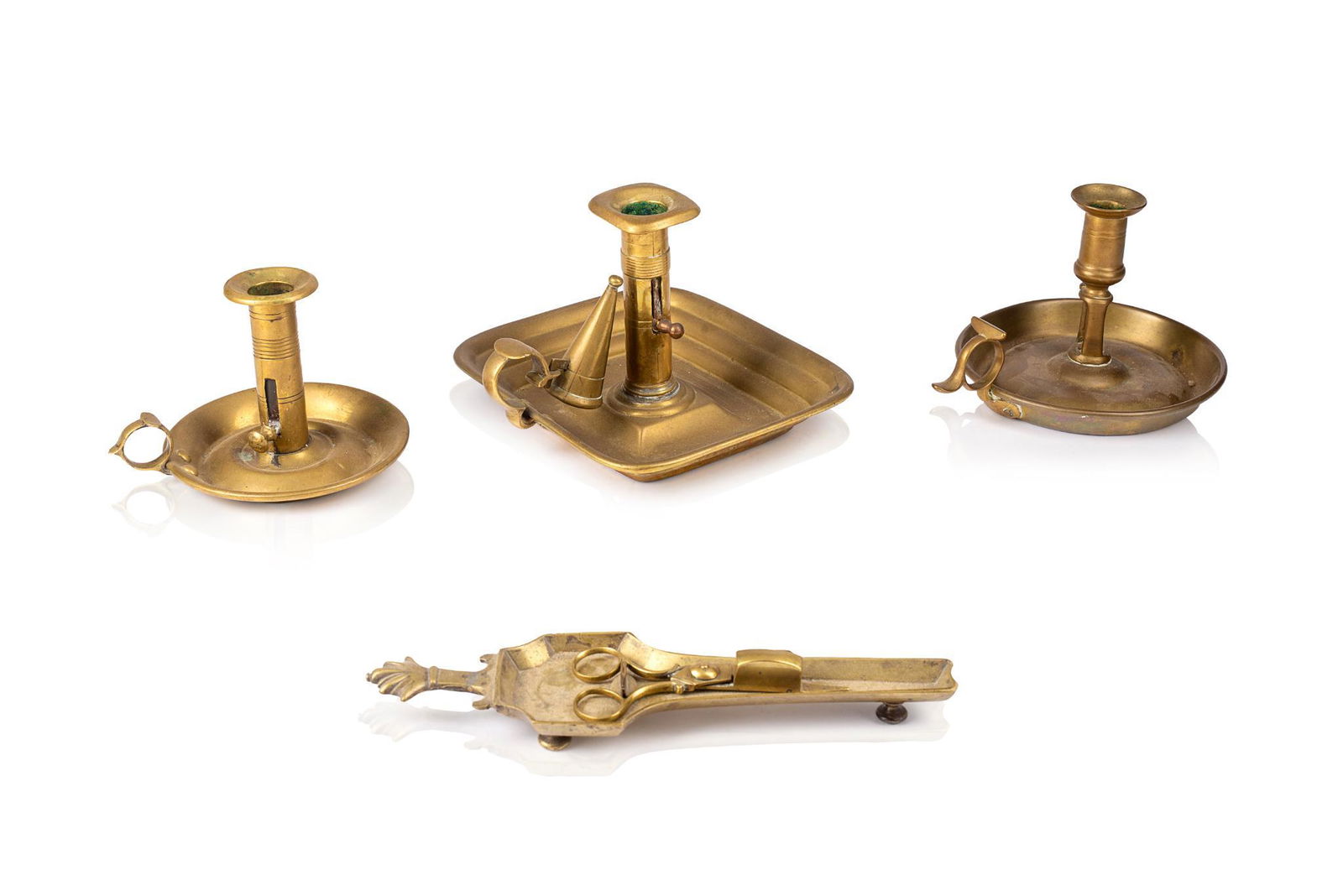 THREE BRASS CHAMBERSTICKS. (1 of 3)