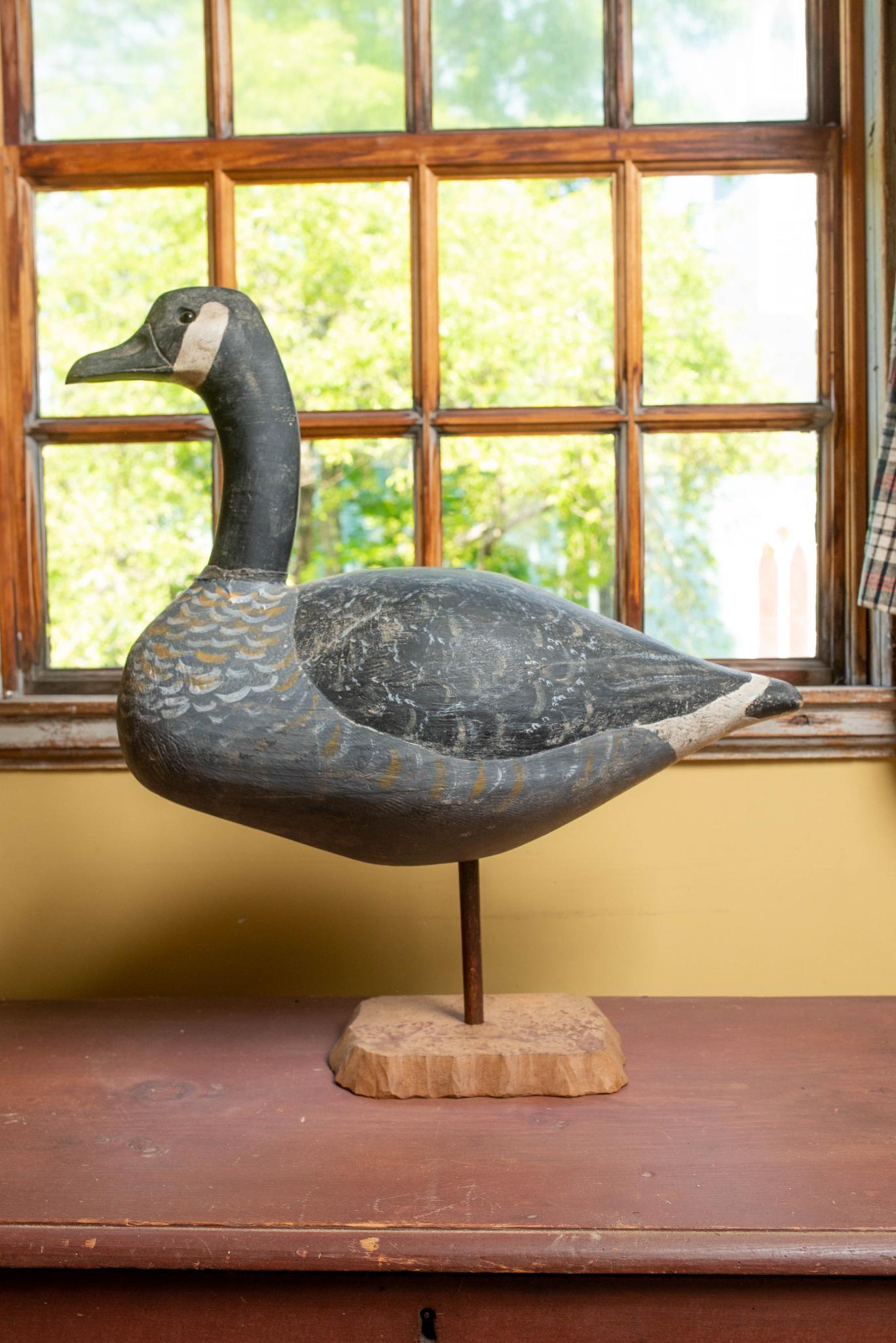 CARVED DECOY OF A GOOSE. (1 of 3)
