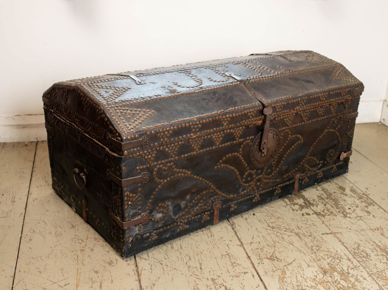 LEATHER COVERED DOME TOP TRUNK. (1 of 7)
