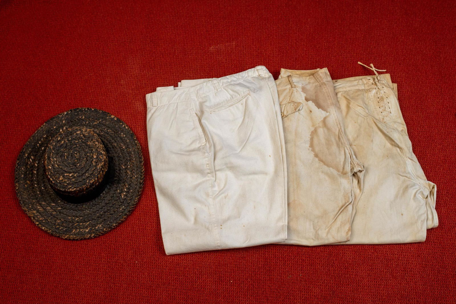 THREE PAIR OF COTTON AND/OR LINEN SAILOR PANTS.: Late 19th/early 20th century together with a straw asphaltum-painted hat