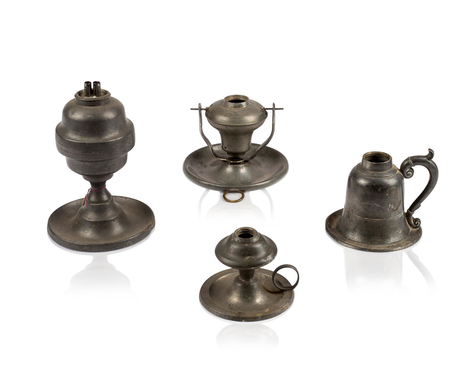 FOUR PEWTER OIL LAMPS. (1 of 2)