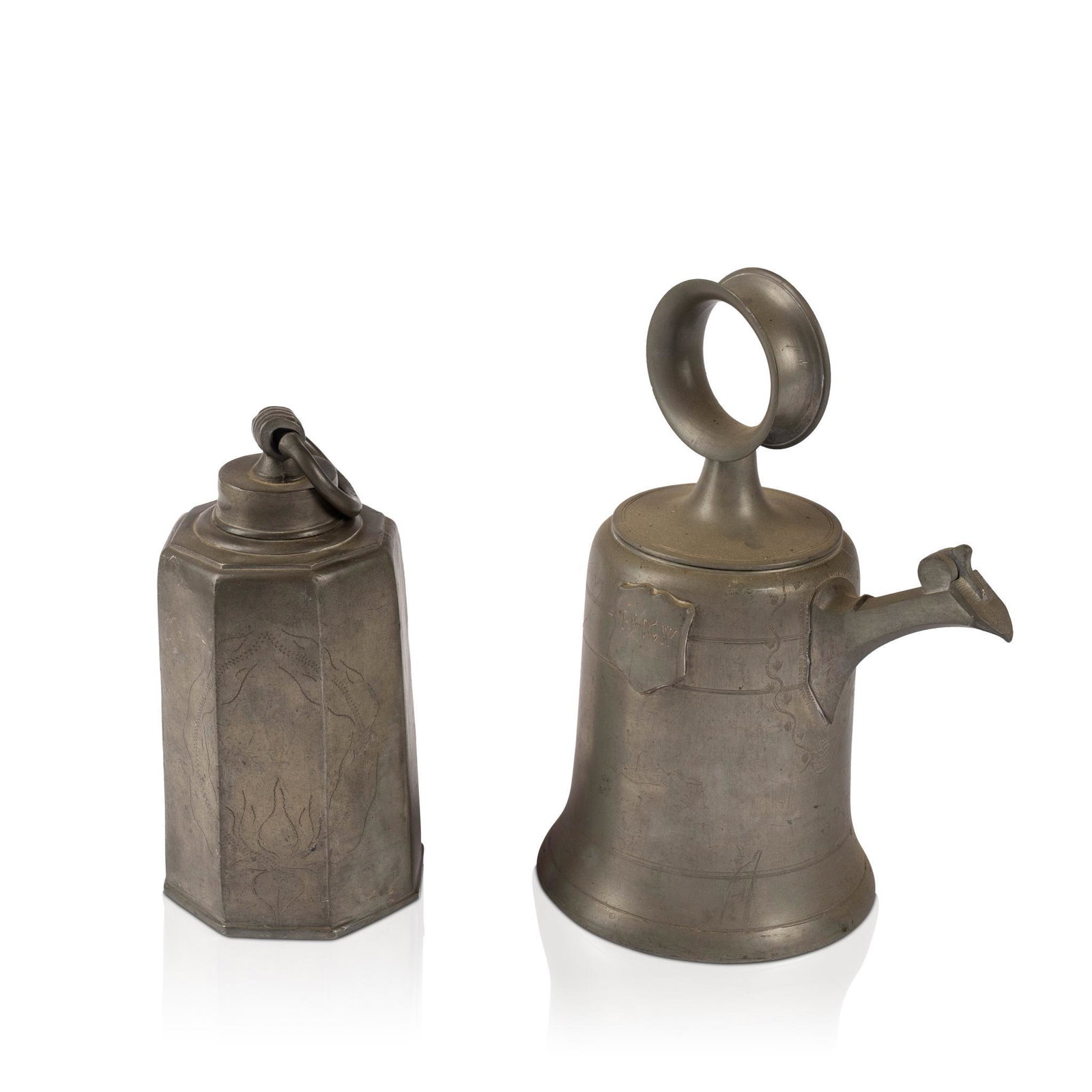 TWO PEWTER WINE CANS.: Both with hexagonal bodies, one spouted. 11 3/8" high, 8 3/4" long, 6 1/4" deep. CONDITION: In antique condition with signs of wear from use.