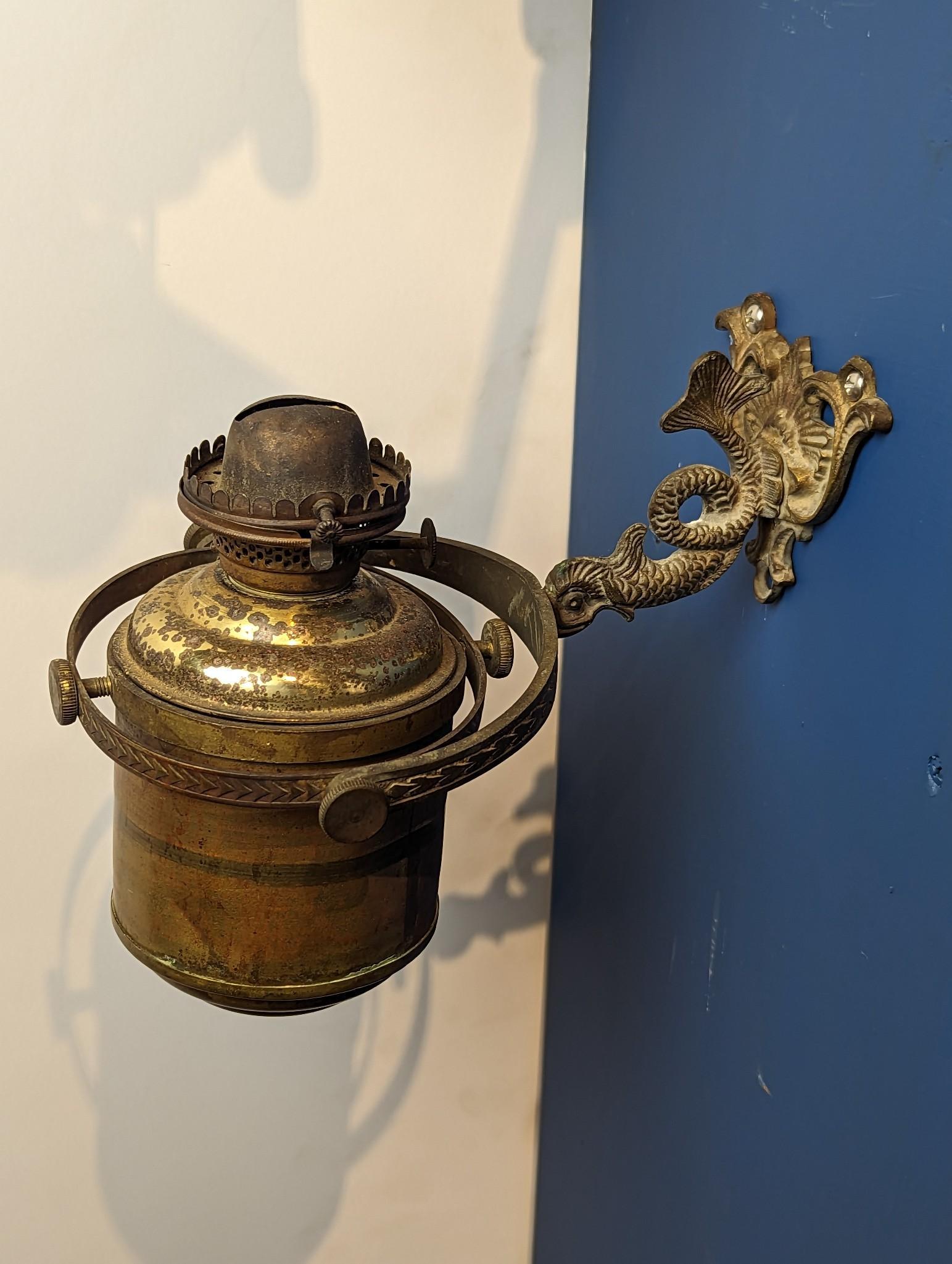SHIP'S BRASS GIMBALLED OIL LANTERN WITH SERPENT MOUNT. (1 of 2)