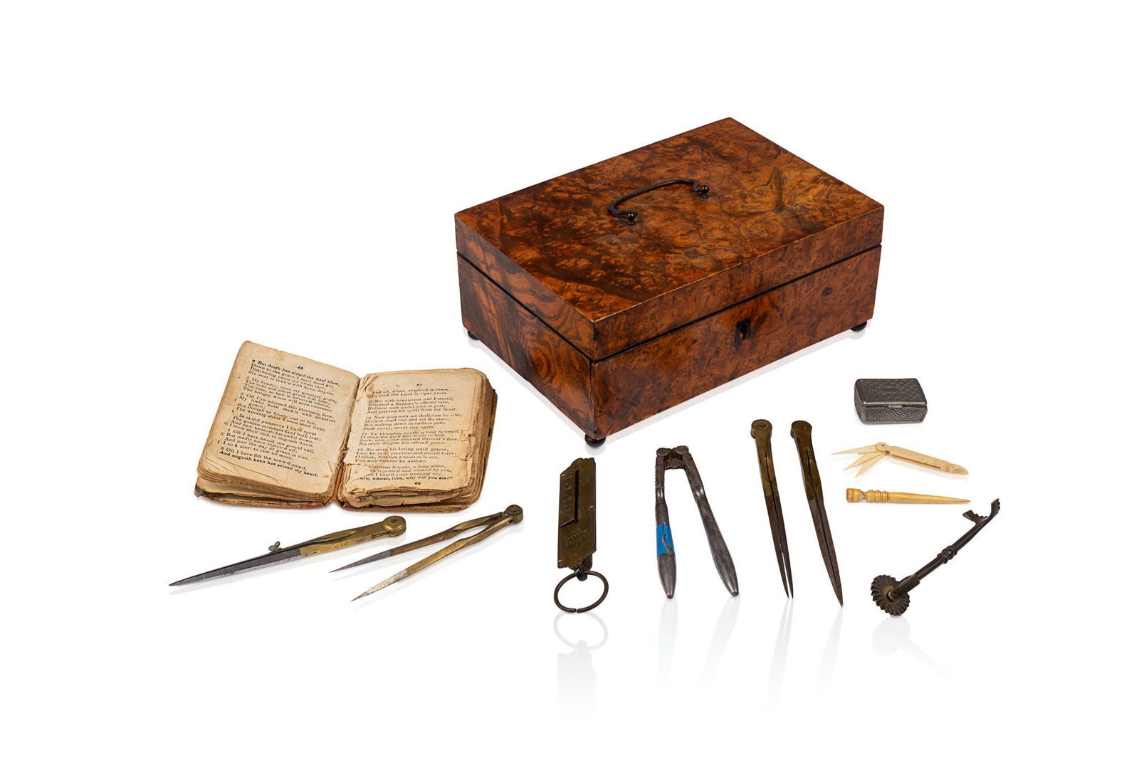 BURL BOX WITH CONTENTS: With small 1837 hymnal, bone bodkin, coins, drafting tools etc. 8 x 6 x 3.5 inches.