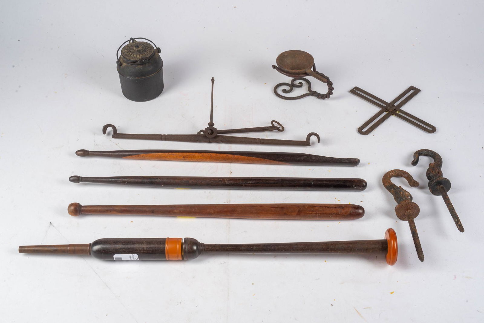 LOT OF EXOTIC WOOD ITEMS TOGETHER WITH IRON OBJECTS.: Lignum vitae and rosewood drum sticks, gavel, musical instrument, scales, glue pot, dolphin hooks, twist stand. 9 items.