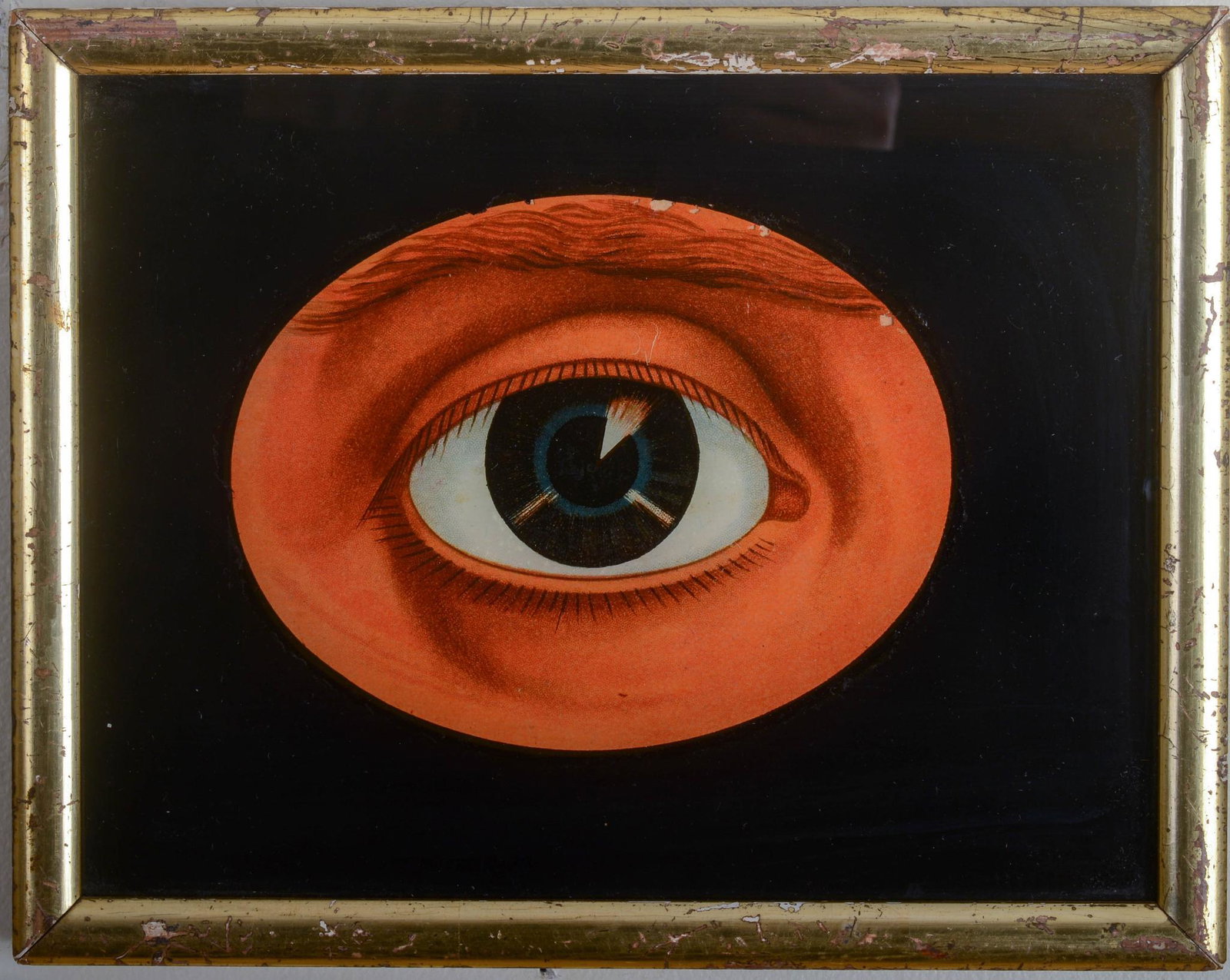 Reverse Lithograph on Glass of an Eye.: Original gilt frame, 19th c. Image 5.75 by 4.5 inches. Frame 9.75 by 7.75 inches.