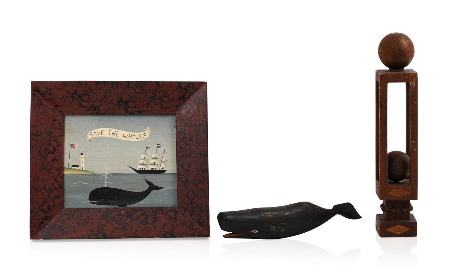 Two Folk Art Whale Items.: Carved wooden whale, length 7.5 inches (loss to taill, and a 20th century painting in grain painted frame. Together with a trapped ball carving.