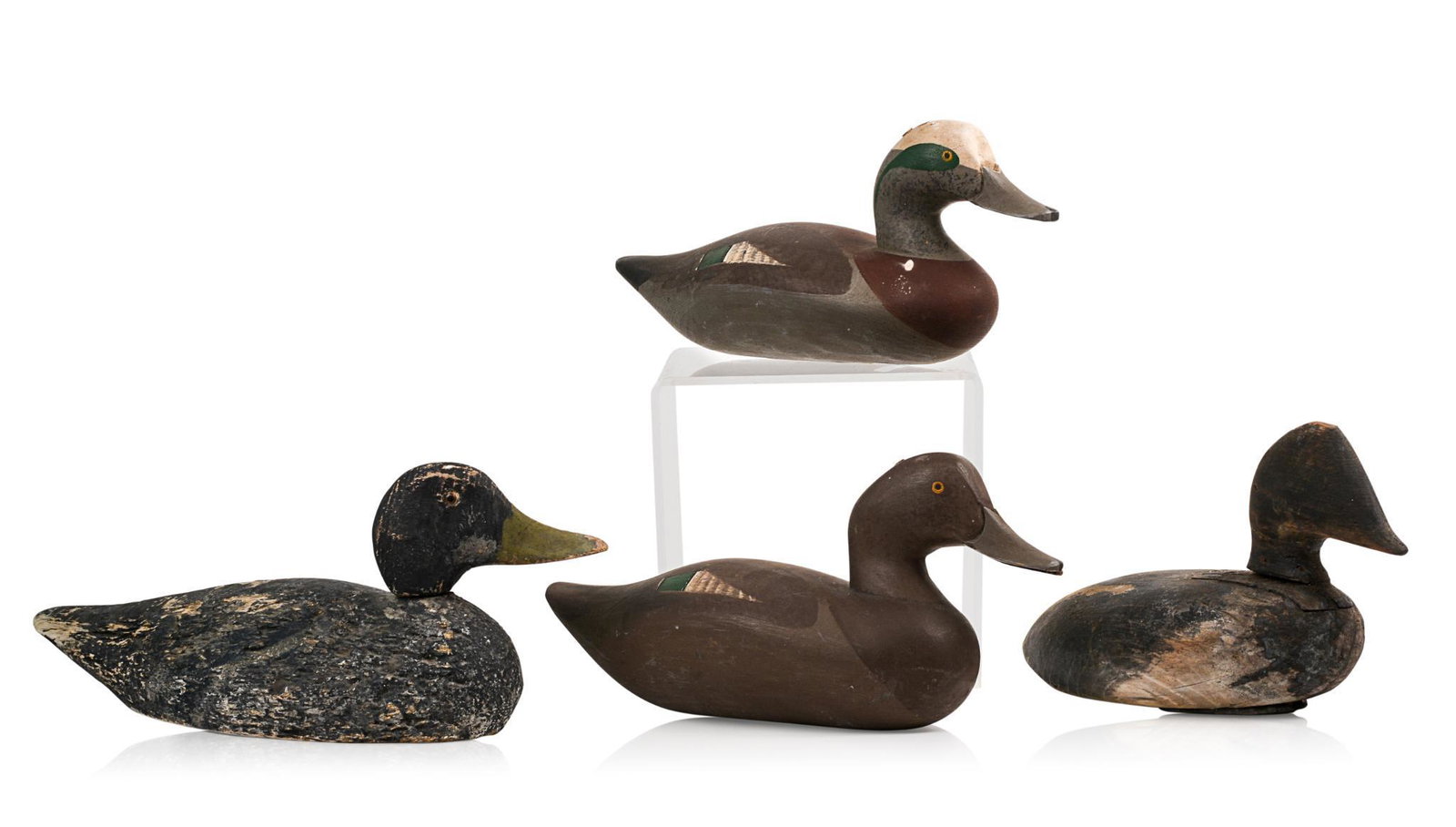 Four Carved and Painted Decoys.: Lengths 12 to 16 inches.