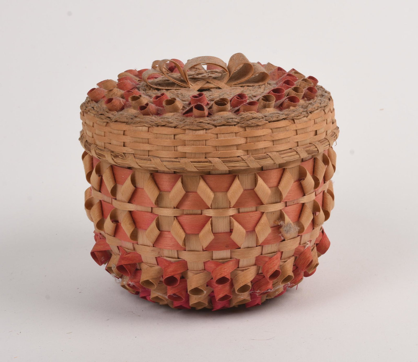 Clara Neptune Keezer Wabanaki Woven Basket.: Passamaquoddy. Round, red stripes, and with cover. Height 4.5 inches, diameter 5 inches.