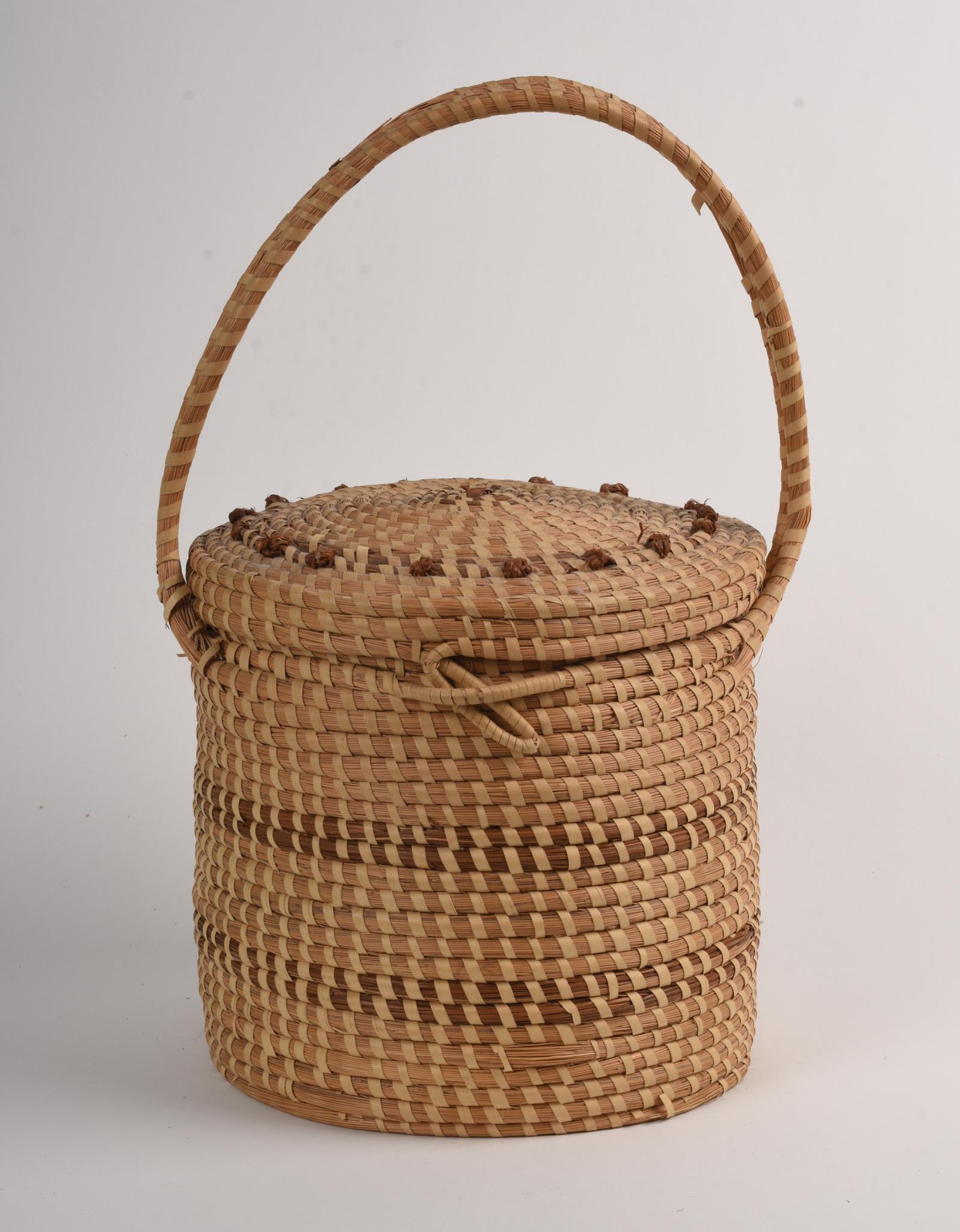 Jery Bennett-Taylor Woven Basket.: Unsigned. Sales flier included. South Carolina. Height over handle 16 inches.