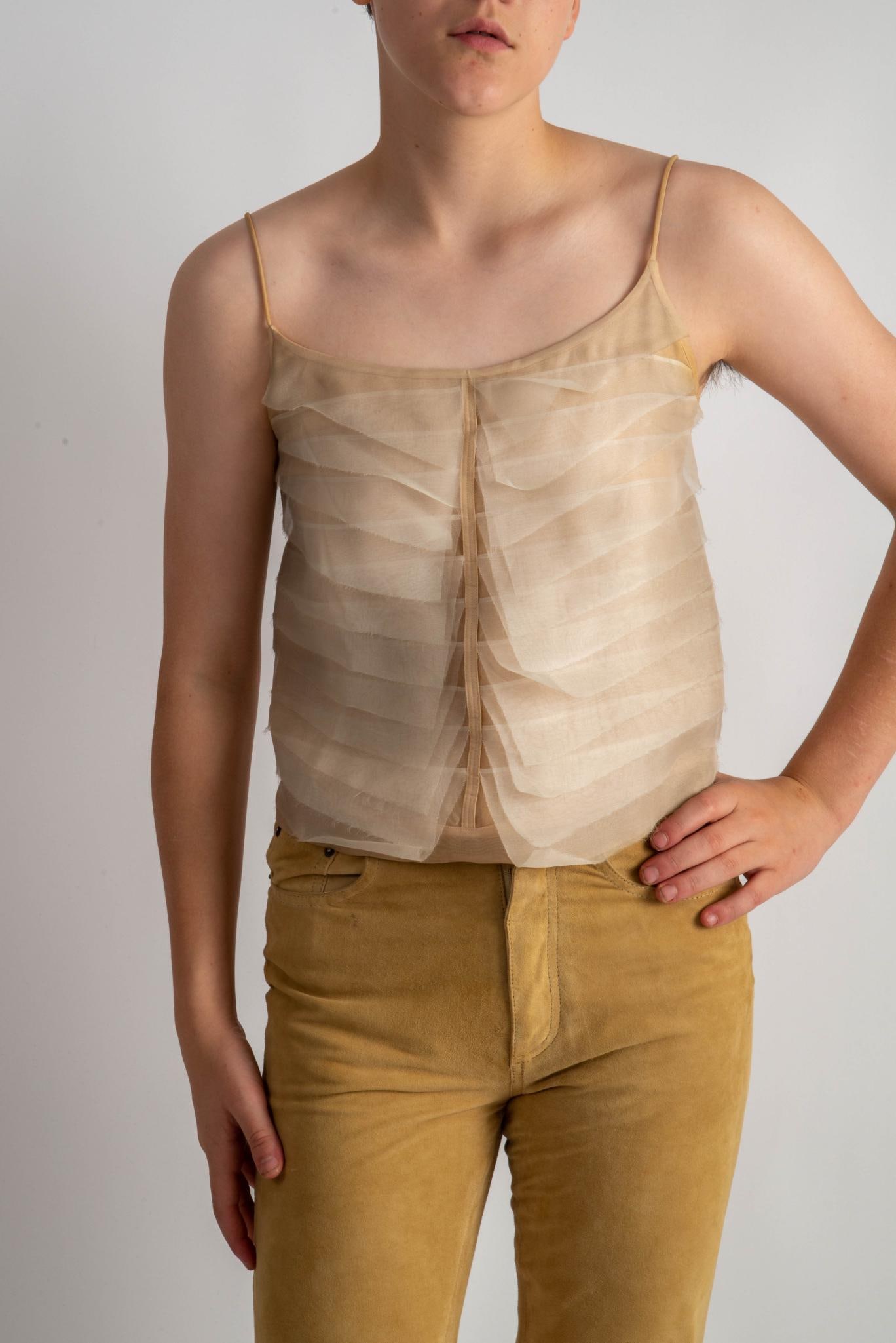 Chanel Silk Camisole with Sheer Layers and Button Back, 36: Size 36, cream color. CONDITION:These are used articles, and may exhibit minor stains, wear, slight odors, and other minor defects. We have attempted to show any major damage in photographs and note i
