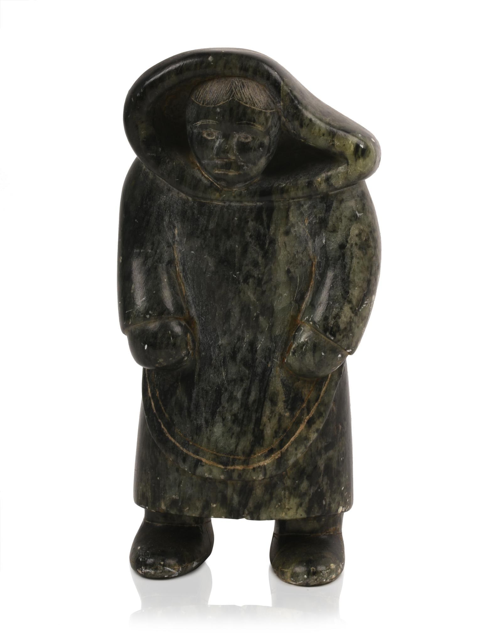 Inuit Soapstone Carving of a Woman.: Height 8 inches.