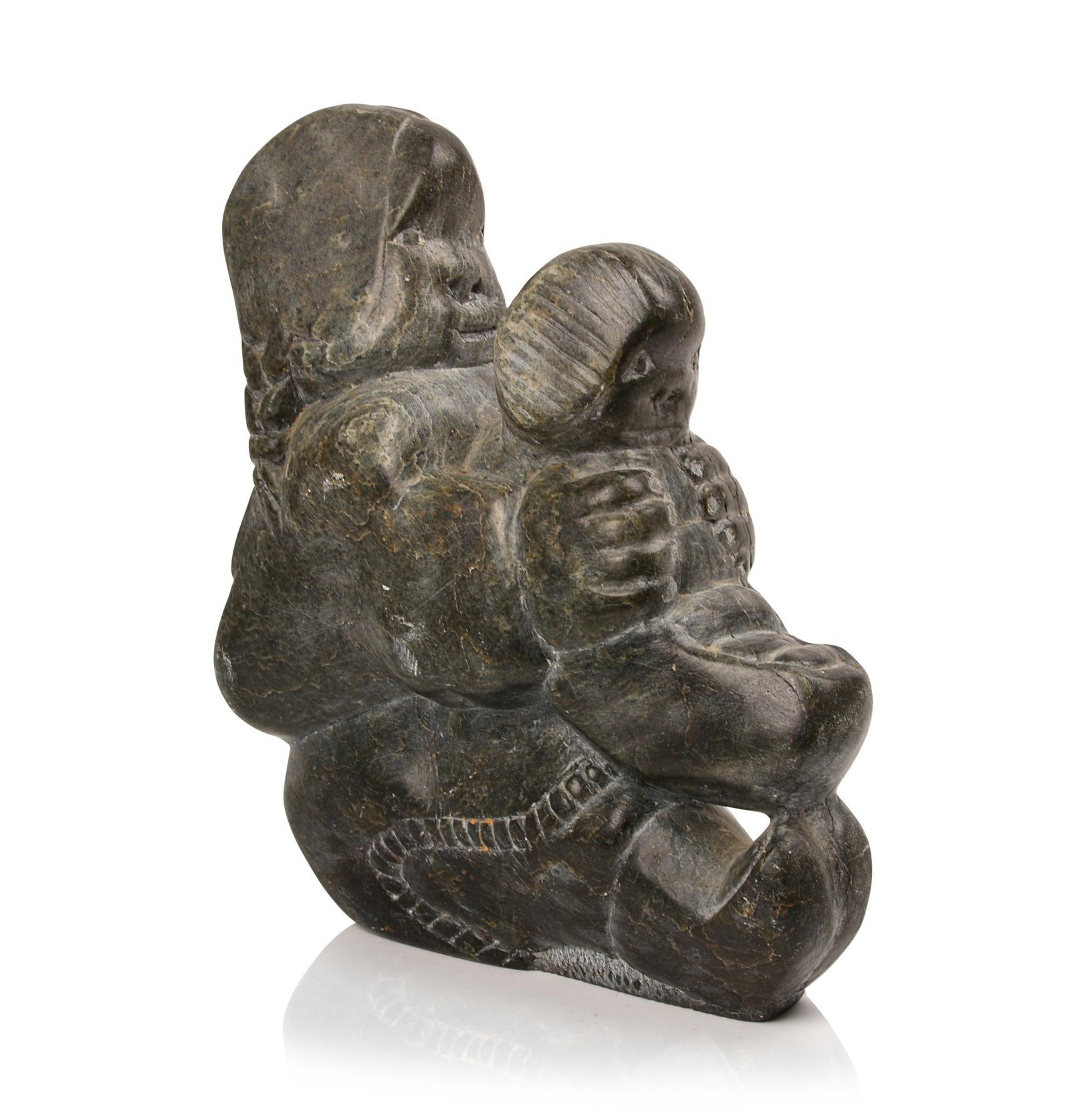 Canadian Inuit Soapstone Carving of Mother and Child.: Height 9 inches with original label signed at base.