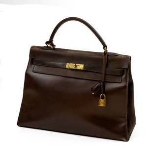 Hermes Kelly 35 Handbag in Brown: Height 10 inches, width 12.5 inches. With lock and key, wear to edges, minor damage to handle.