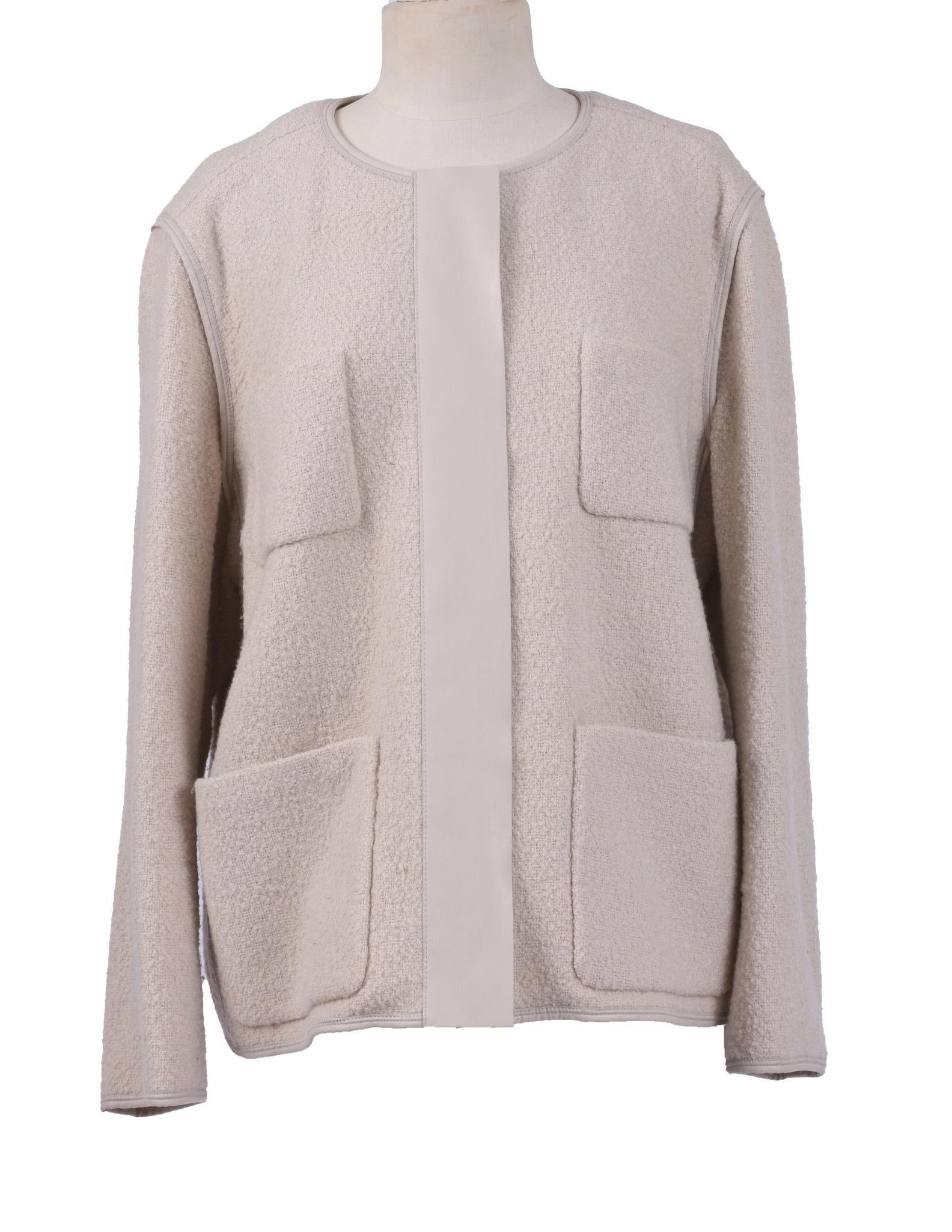 LAFAYETTE 148 BOUCLE WOOL JACKET: With leather trimmed zippered front. The jacket a cold cream with nude colored leather accents. The size XL. In very good condition.