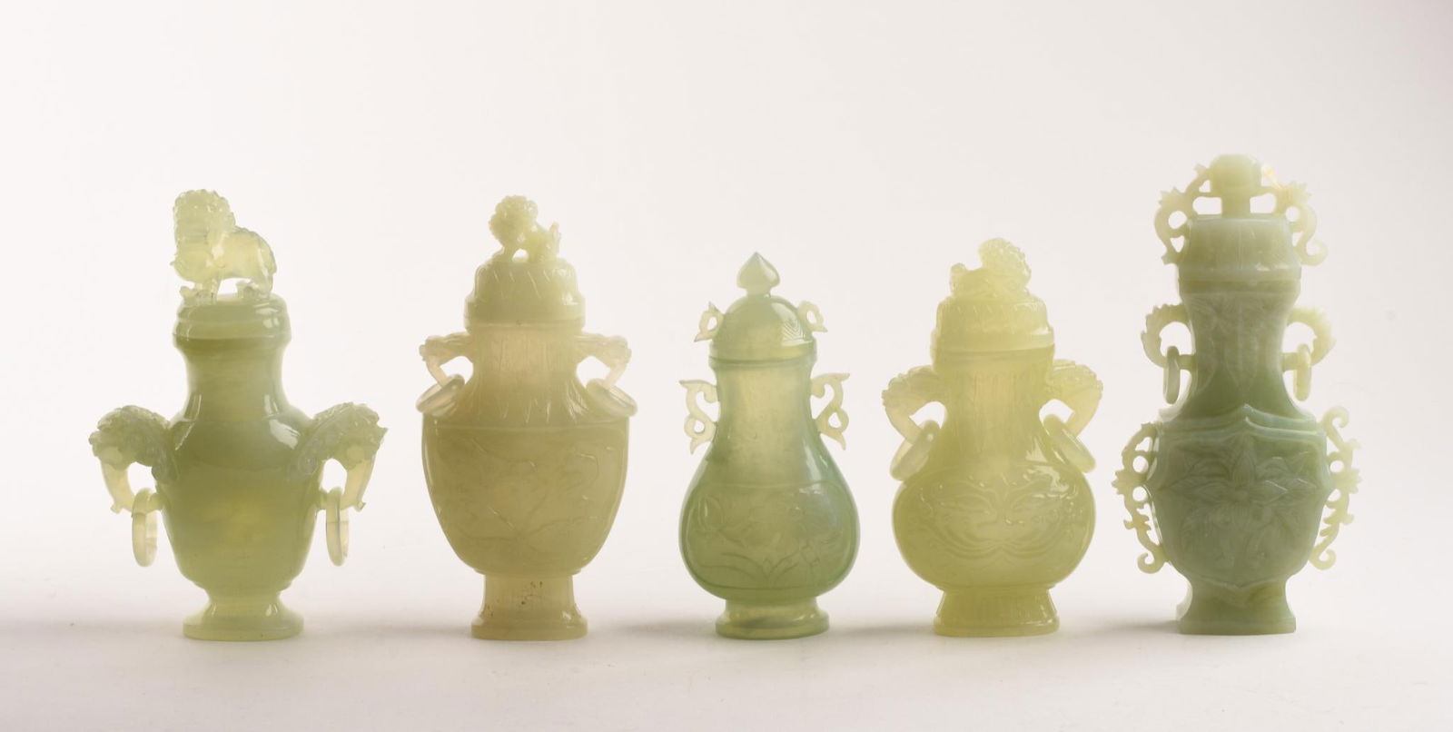 FIVE FINE CHINESE CELADON CARVED JADE URNS. (1 of 14)