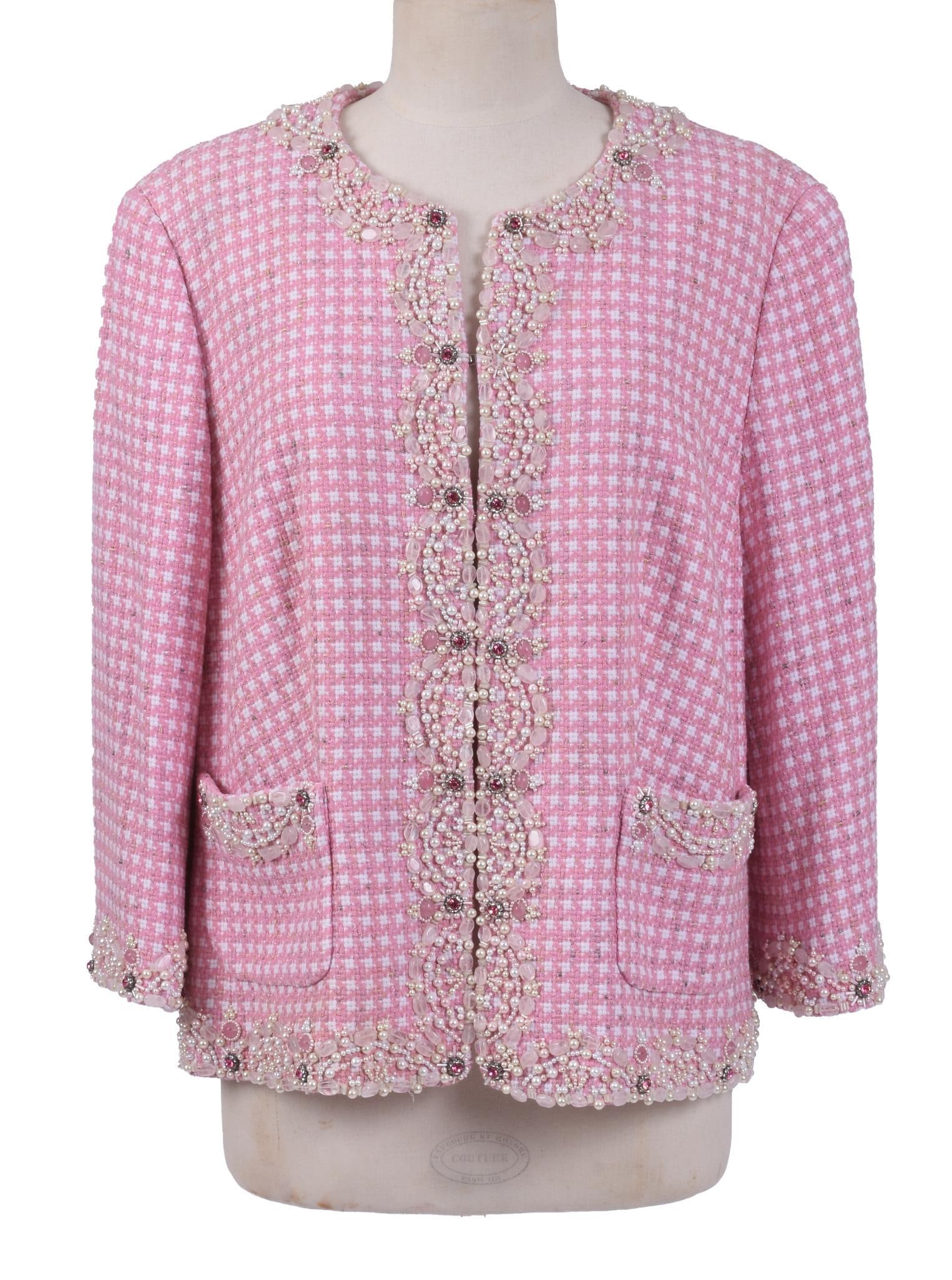 ESCADA PINK & WHITE WOVEN BOUCLE EVENING JACKET: With jewel embellishment on edges and open pockets. Size 46. Very good condition. A few embellishments missing, hardly noticeable. A couple pulled threads, does not affect integrity of jacket.