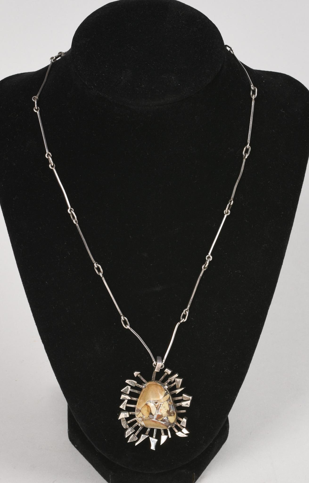 Rey Urban Sterling Necklace.: Sterling pendant centered with puddingstone, signed, Swedish hallmarks, date code for 1965. Pendant 1.75 x 1.5 inches, chain 16 inches.