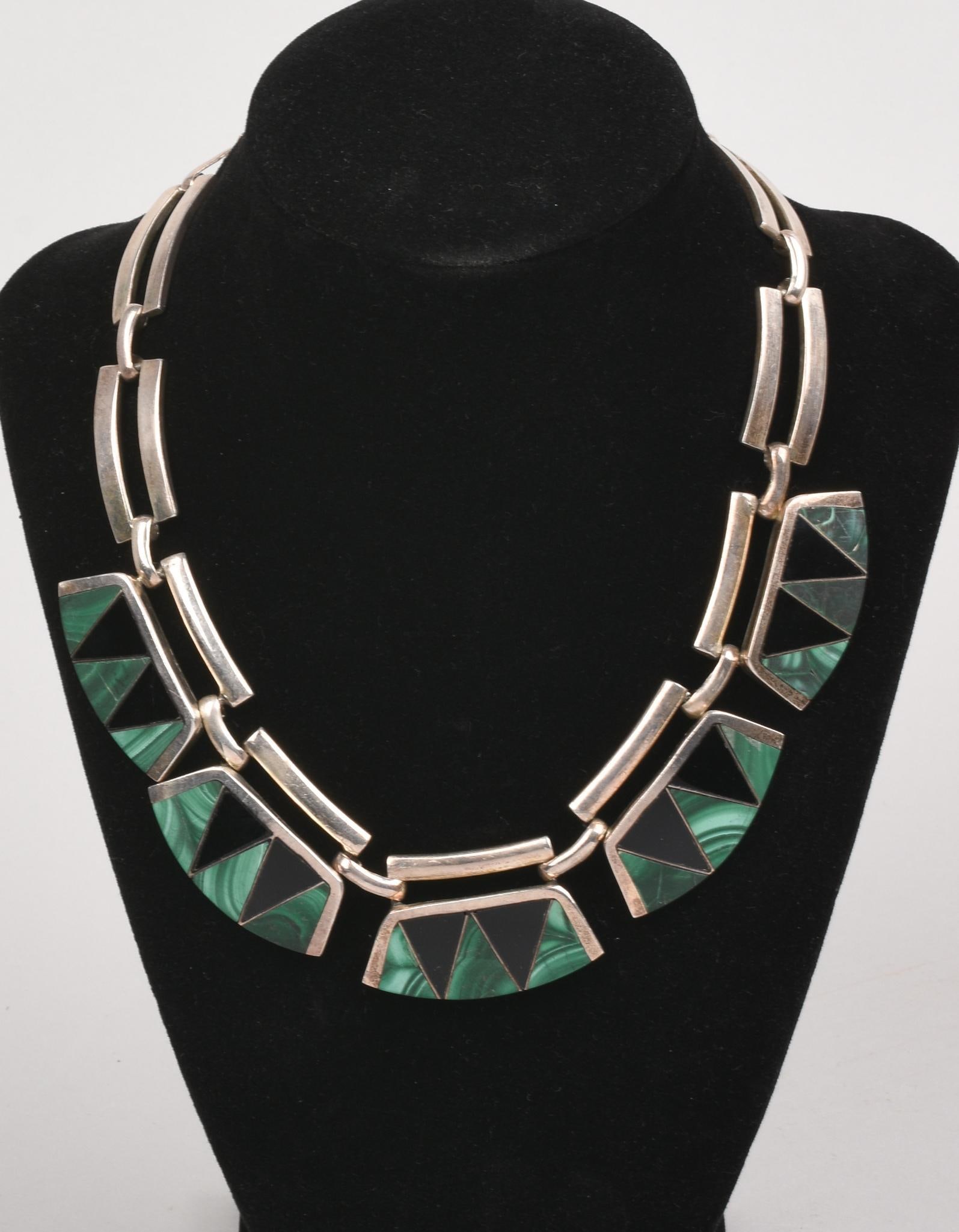 Mexican Sterling and Stone Necklace: Alachite and possibly obsidian, signed Sheila and stamped 925 Mex, 3.8 ozt, inside diameter 5 inches.