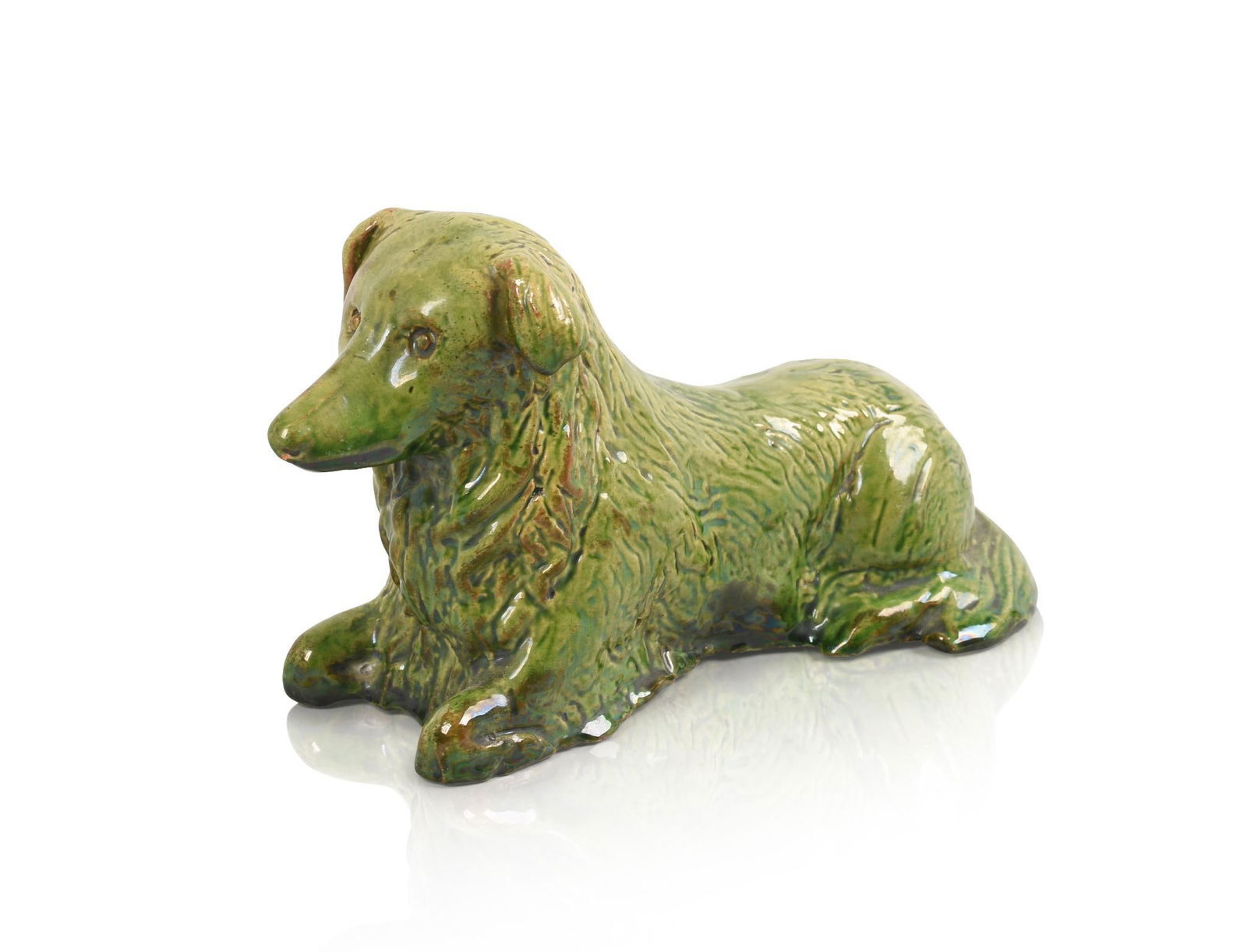 GREEN GLAZED REDWARE DOG.: Length 8 inches. Small crack and one small chip at base.