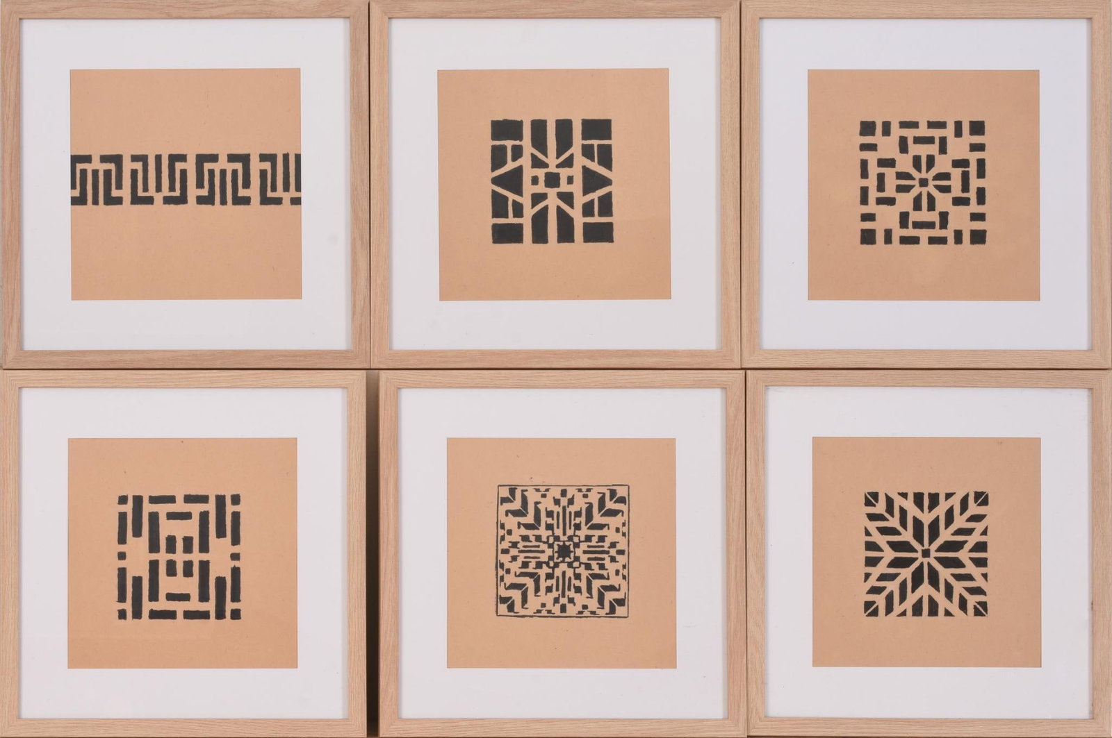 MIRIAM KUEHNEISEN. SIX GEOMETRIC STUDIES INK ON BROWN PAPER: Image 7.25 inches x 7.25 inches, framed 12 inches x 12 inches