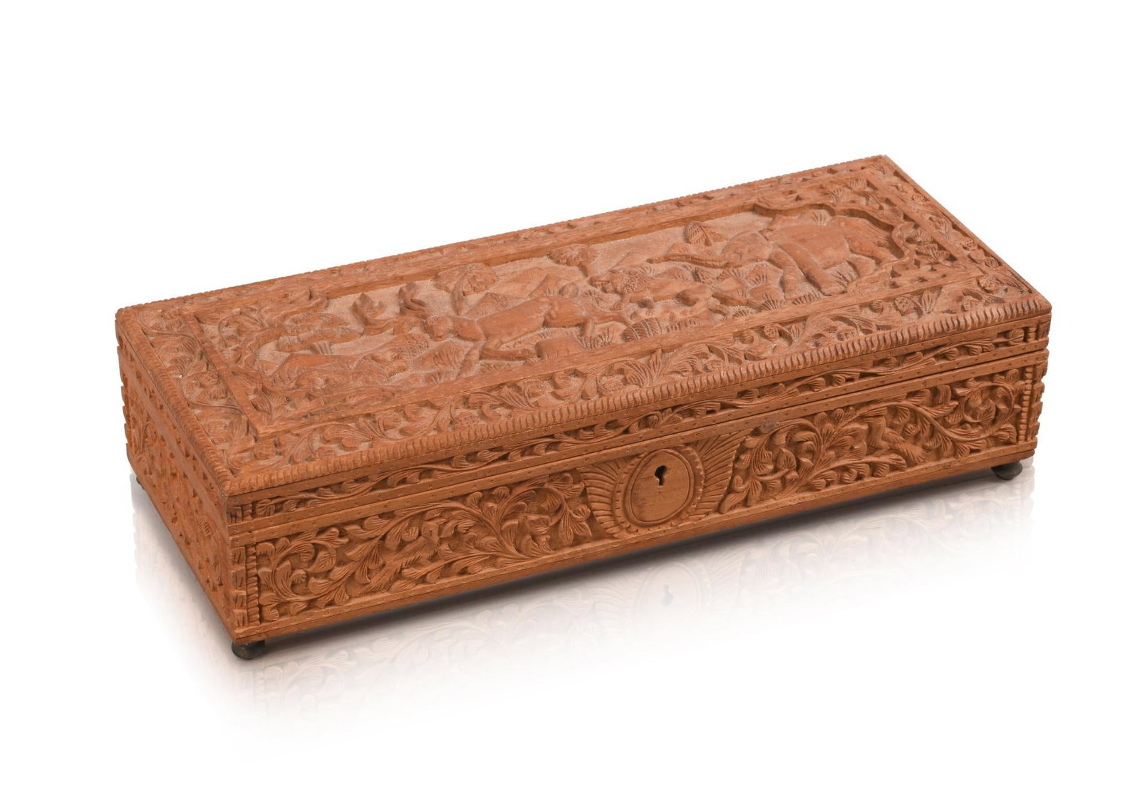 SANDALWOOD CARVED BOX: On bulb feet, with foliage and elephant, lions and antelope scene on hinged lid, height 3 inches, width 11.75 inches, depth 4.75 inches