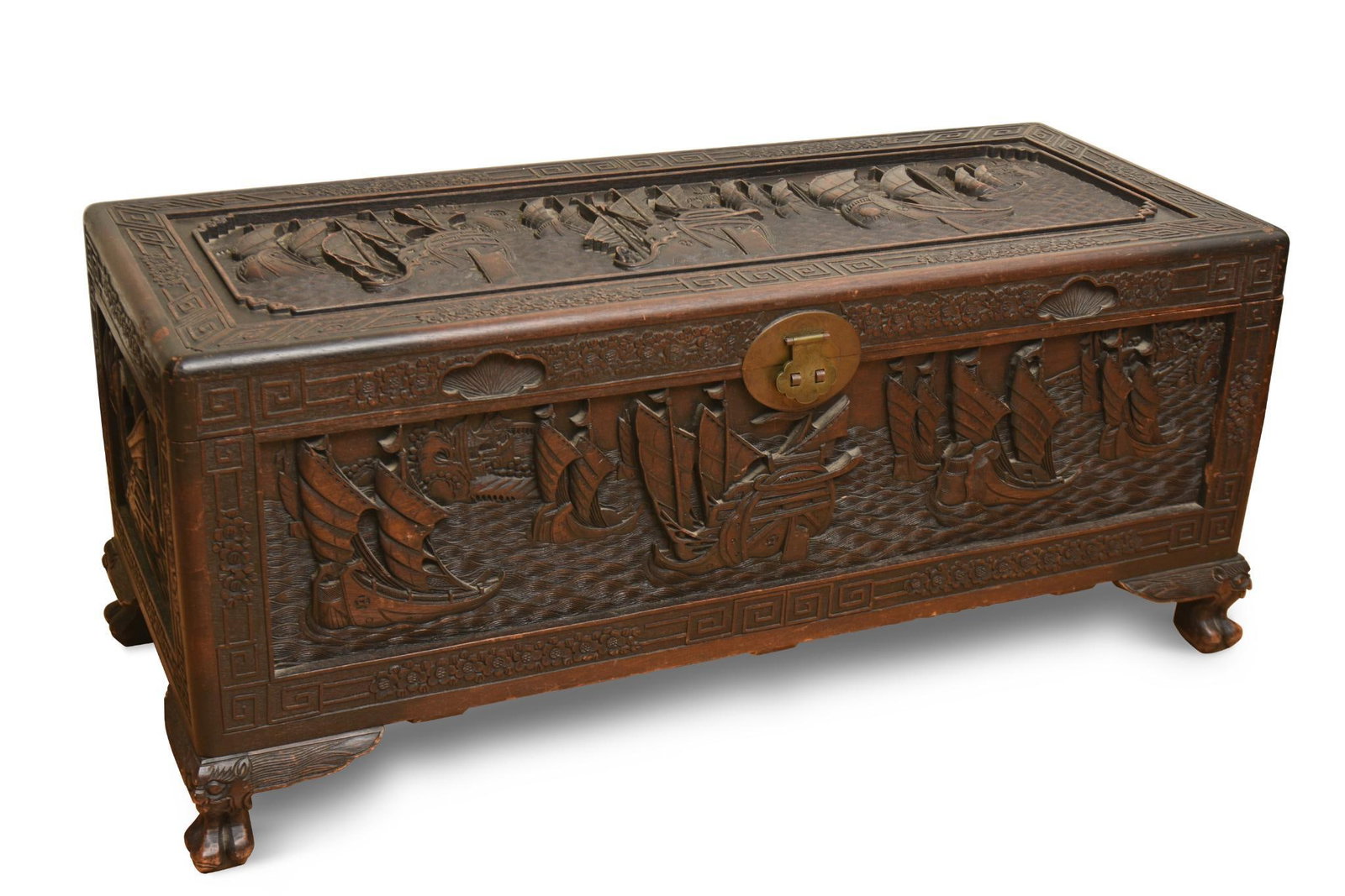 CHINESE CARVED CAMPHOR CHEST: Deeply carved, reportedly a gift to an American executive in the 1940’s from T. V. Soong, height 20.75 inches, width 47.5 inches, depth 20 inches