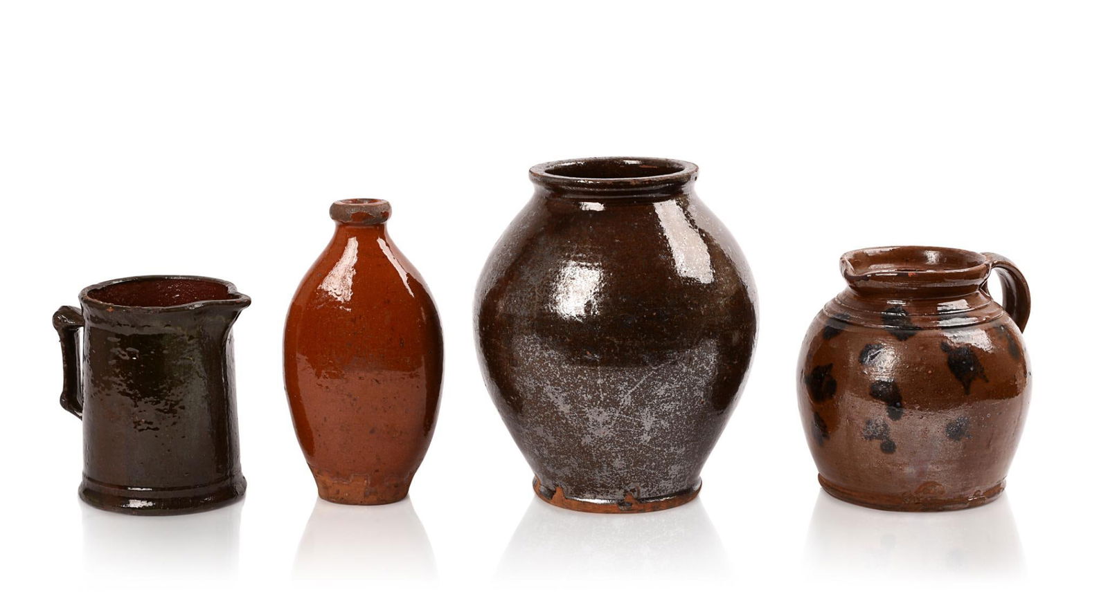 Four Redware Containers.: One flask, large jar (possibly Pennsylvania), handled pitcher (possibly Pennsylvania), and large tankard