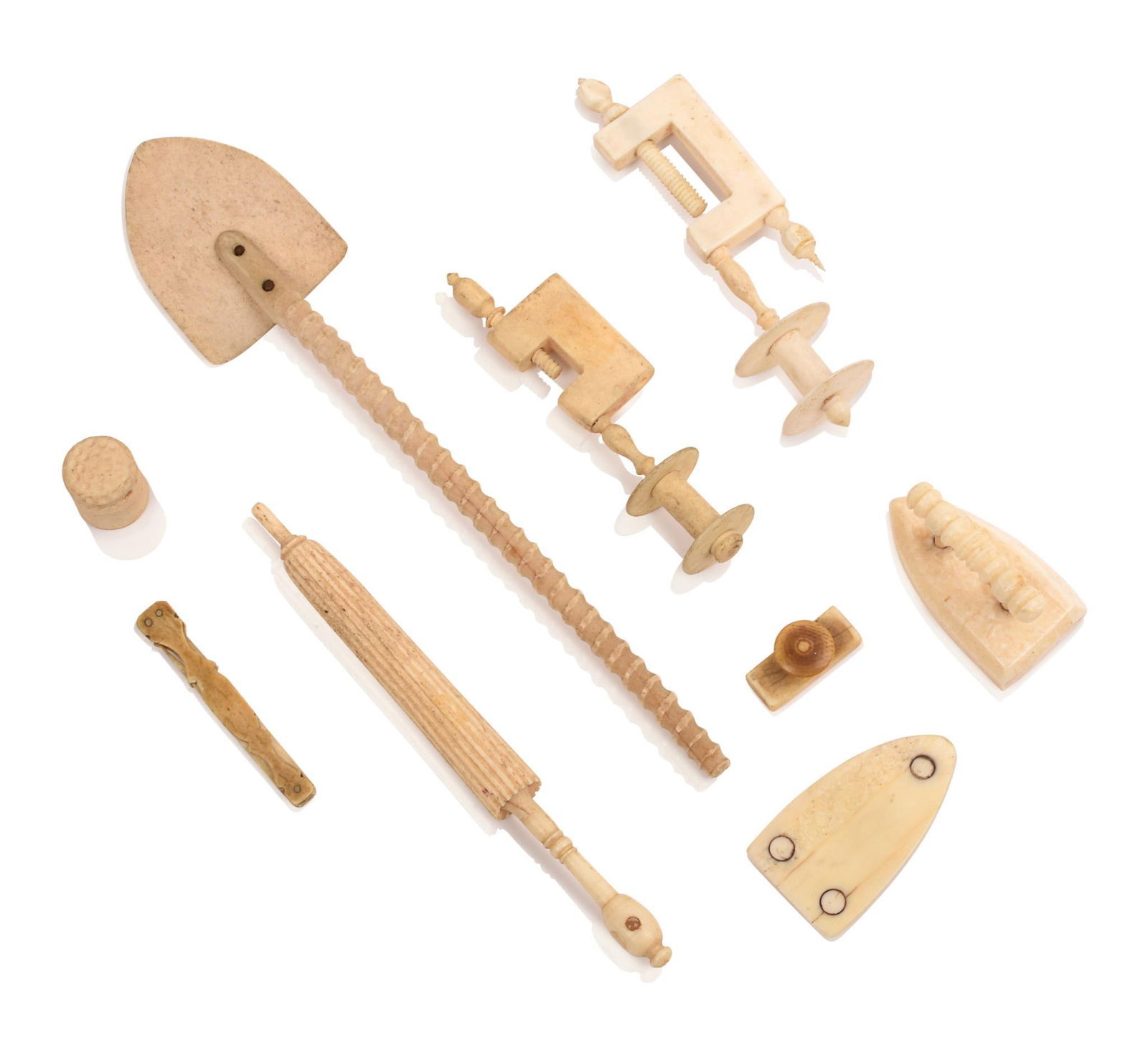 RARE 19TH CENTURY MINIATURE WHALEBONE AND SOUP BONE CHILD’S TOOLS.: Eight pieces: two thread holders, thimble, blotter, flat iron, shovel, umbrella form needle case and grooming tool.Shovel Length: 7?