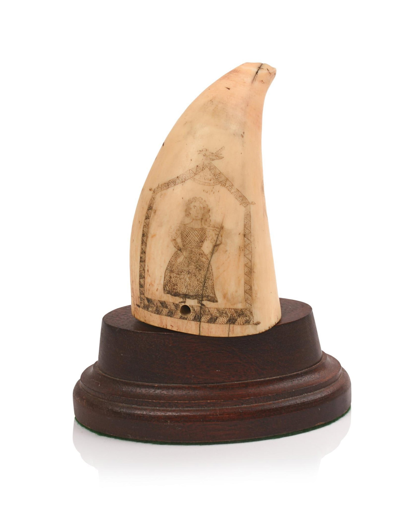 19TH CENTURY SPERM WHALE TOOTH.: The front has the initials “BC” above a bird on a leafy branch with the initials “DC” over a geometric base. The back is decorated with a primitive full-frontal portrait of a Victorian