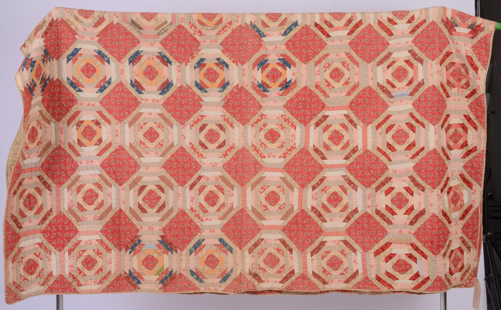 19th Century American Quilt.: Red tones. 76.5 inches by 84.5 inches.