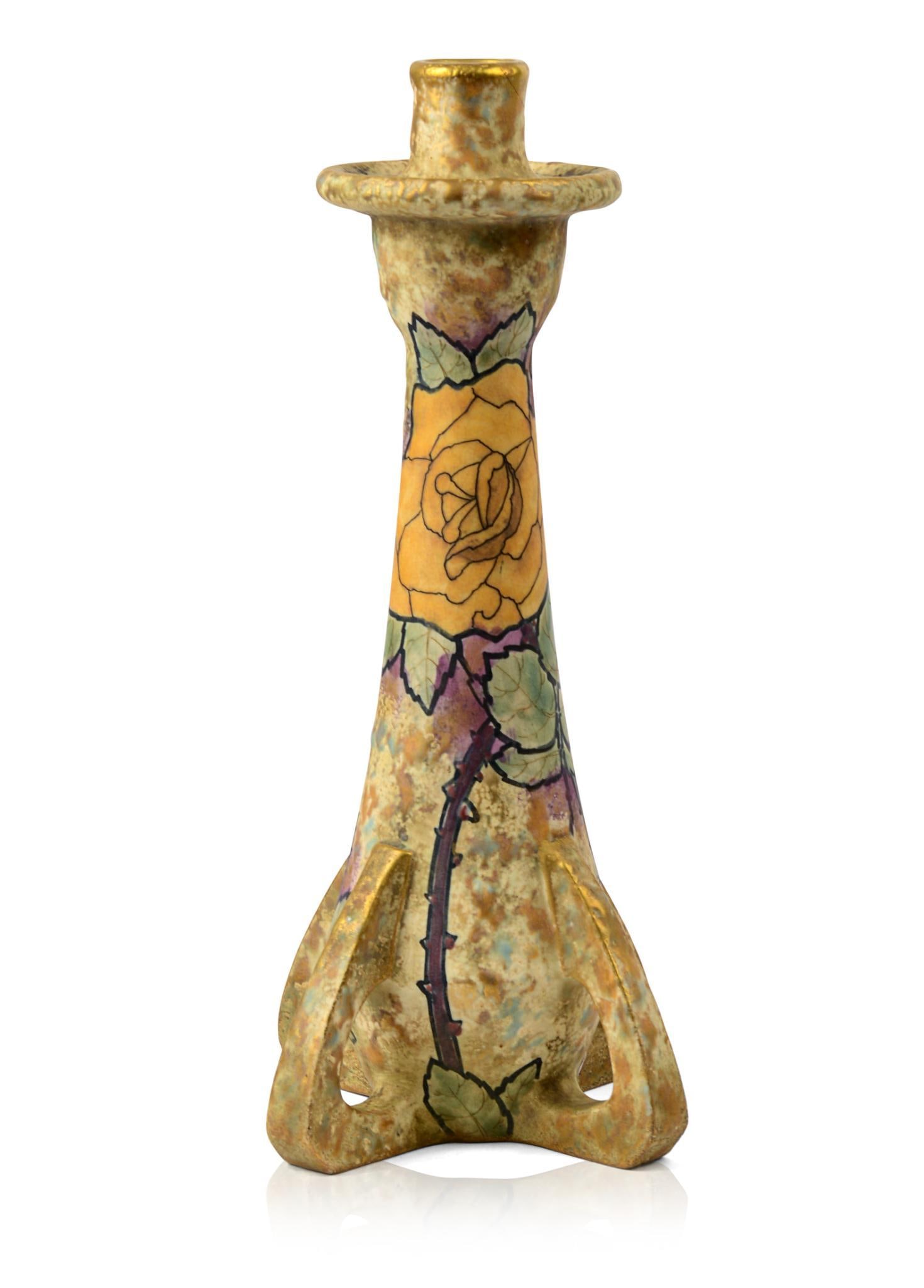 Large Amphora Pottery Buttressed Candlestick.: Yellow Rose decoration on gilt ground, signed, re-attached chip on rim. Height 13.5 inches.