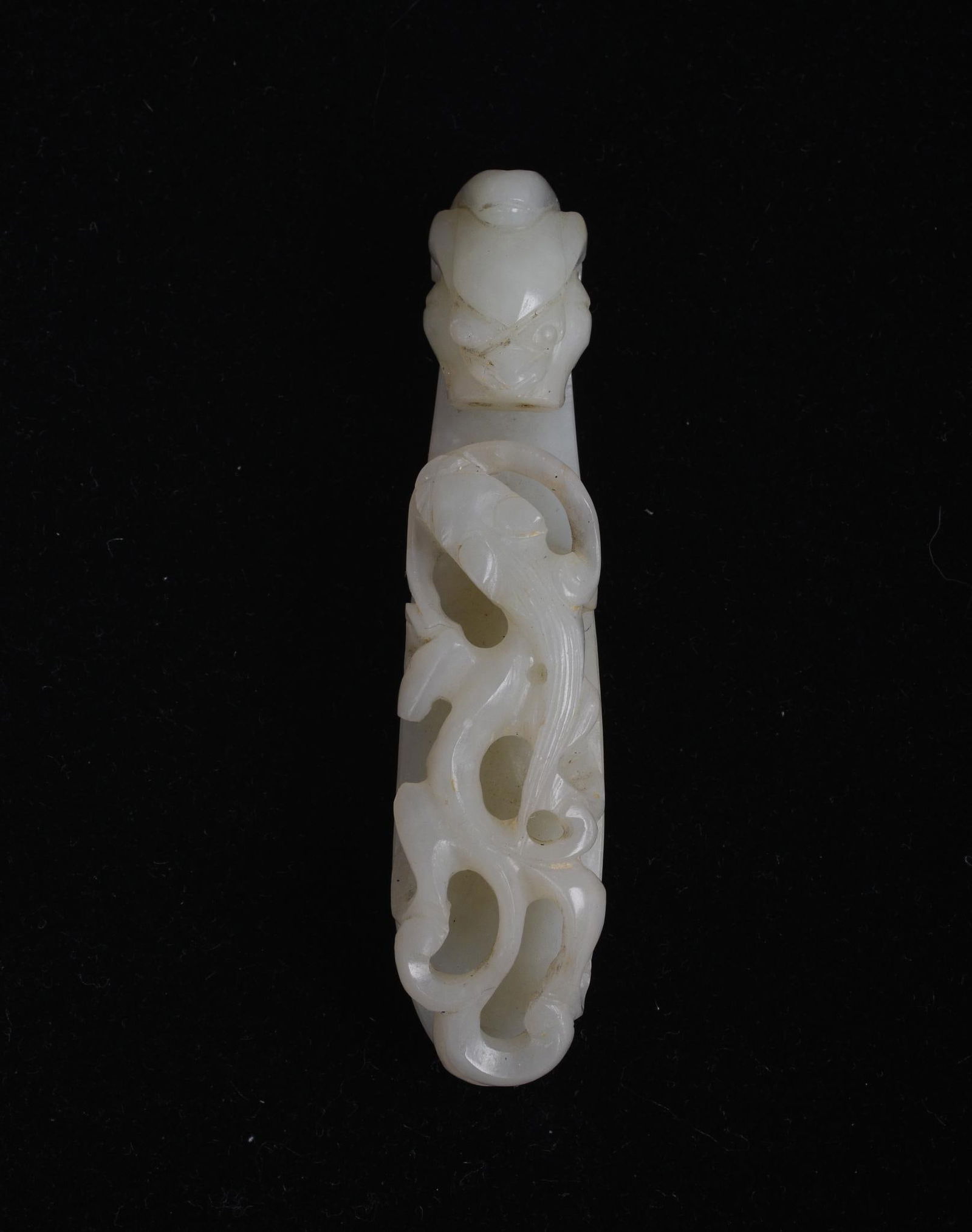 Chinese Carved White Jade Dragon Belt Hook: With dragon and qilong, 19th century. Length 3 inches.
