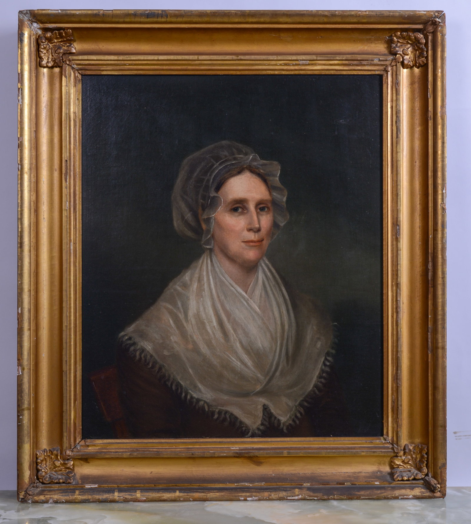 19th Century American School Portrait of a Woman.: Oil on canvas laid on board, 30 x 25 inches. In a period gilt frame, 39 x 33 inches. Mclees gallery label on verso. "SHIPPING In house shipping is available for this item. Please allow 1-2 weeks for d
