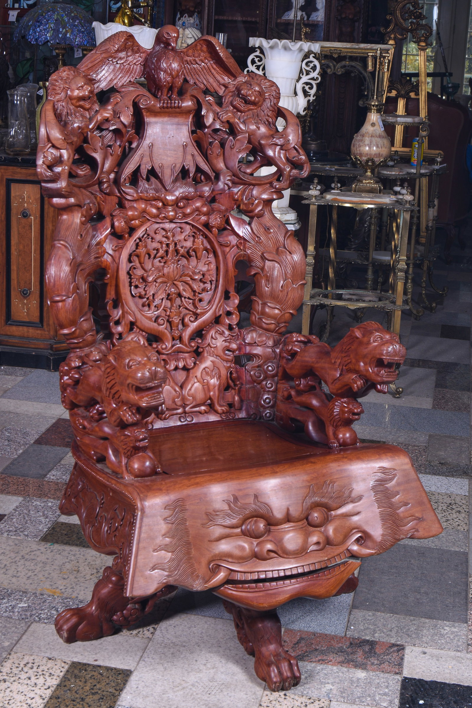 Northwinds Inspired Great Chair.: "The front with face with articulated mouth, arms with lions, back with a crest of an eagle and two lions. Seat height 21 inches, overall height 58 inches, width 33 inches. Extremely heavy carved wood
