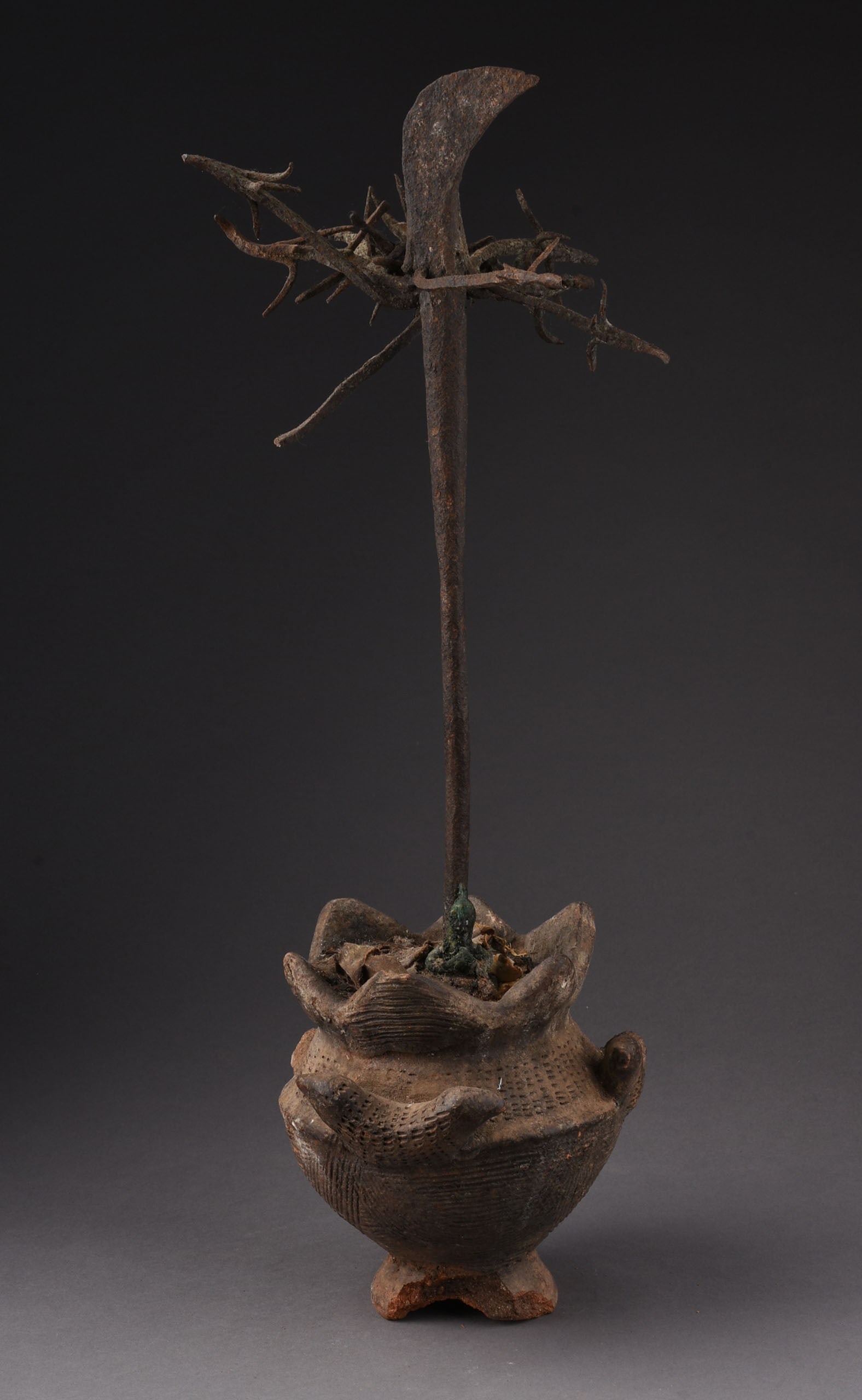 OSAYIN MEDICINE STAFF, EDO-BENIN ,NIGERIA 1800'S: Height 21.5 inches. Old breaks. This slender elongated rod, flanked by stylized birds and inserted into a clay medicine bowl, containing magical material and soil . Its purpose is to surmon protection
