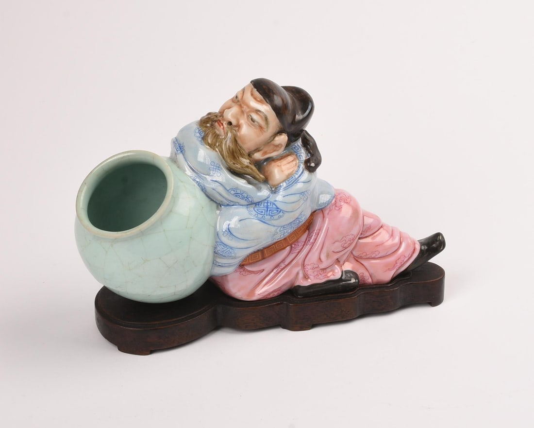 Asian Figure Holding an Urn on Wood Stand: Length 7 inches