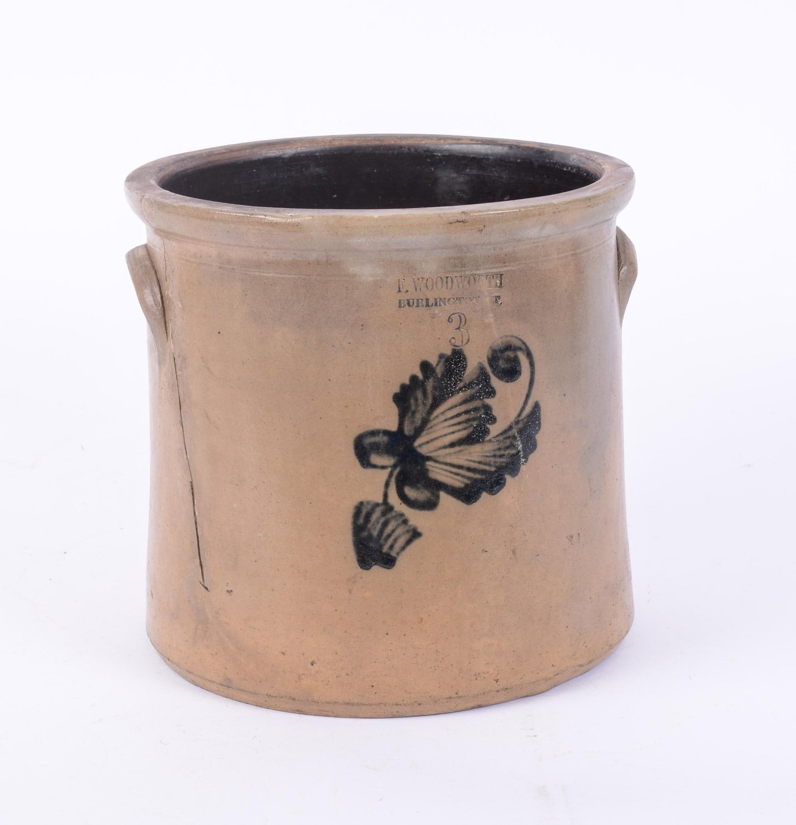 F. WOODWORTH 3 GALLON CROCK WITH COBALT DECORATION.: Height 10.5 inches. Crack to side