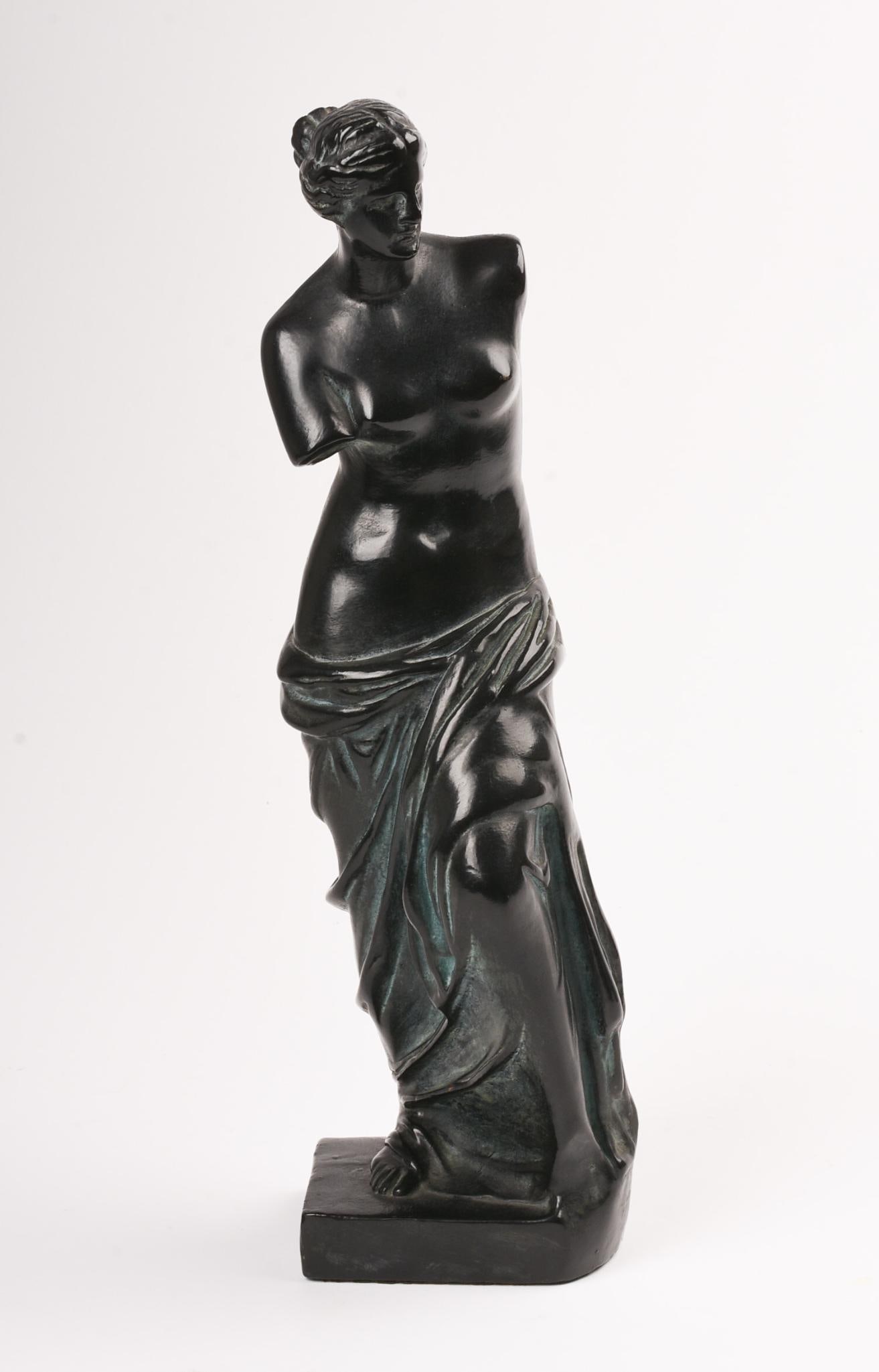 Armor Bronze Sculpture of a Woman: Height 12 inches. Note: Armor Bronze is the brand, this is magnetic, and appears to be a patinated metal of some sort.