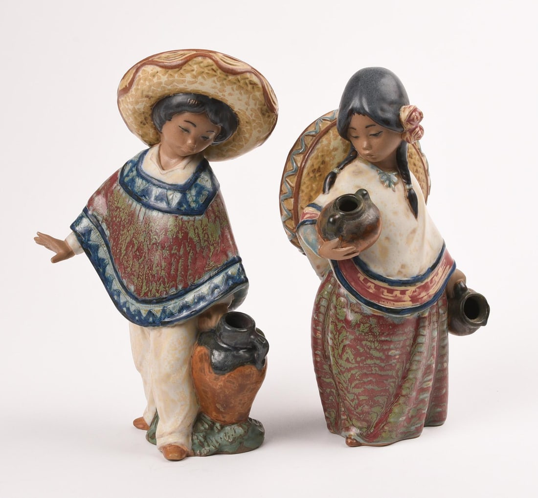 Pair of Lladro Figurines: Heights 7.5 and 8.25 inches.