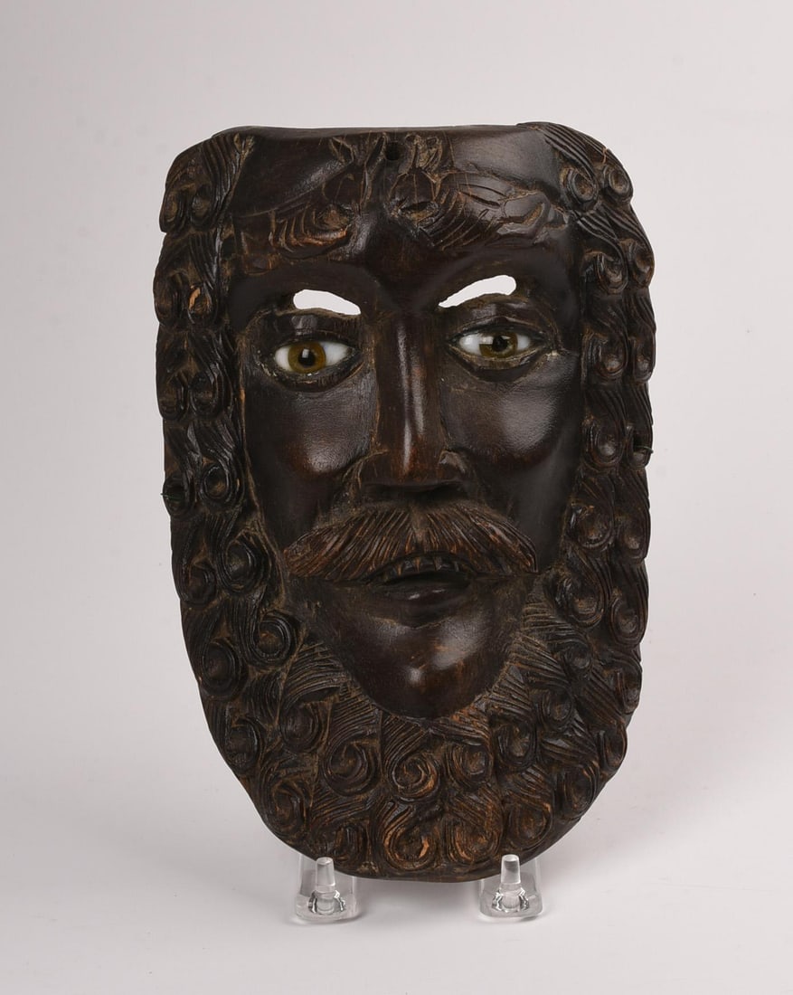 Carved Wood Mask of a Man with Stylized Beard: And glass eyes, height 9.5 inches