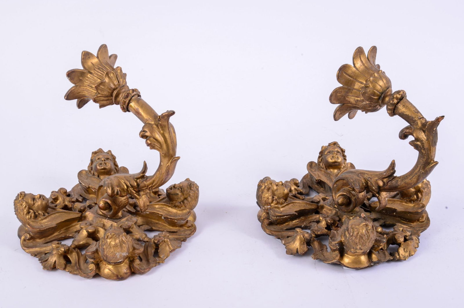 Pair of Wood Gold Painted and Carved Wall Sconces: With foliage and cherubs, height 9.5 inches, repairs and cracks