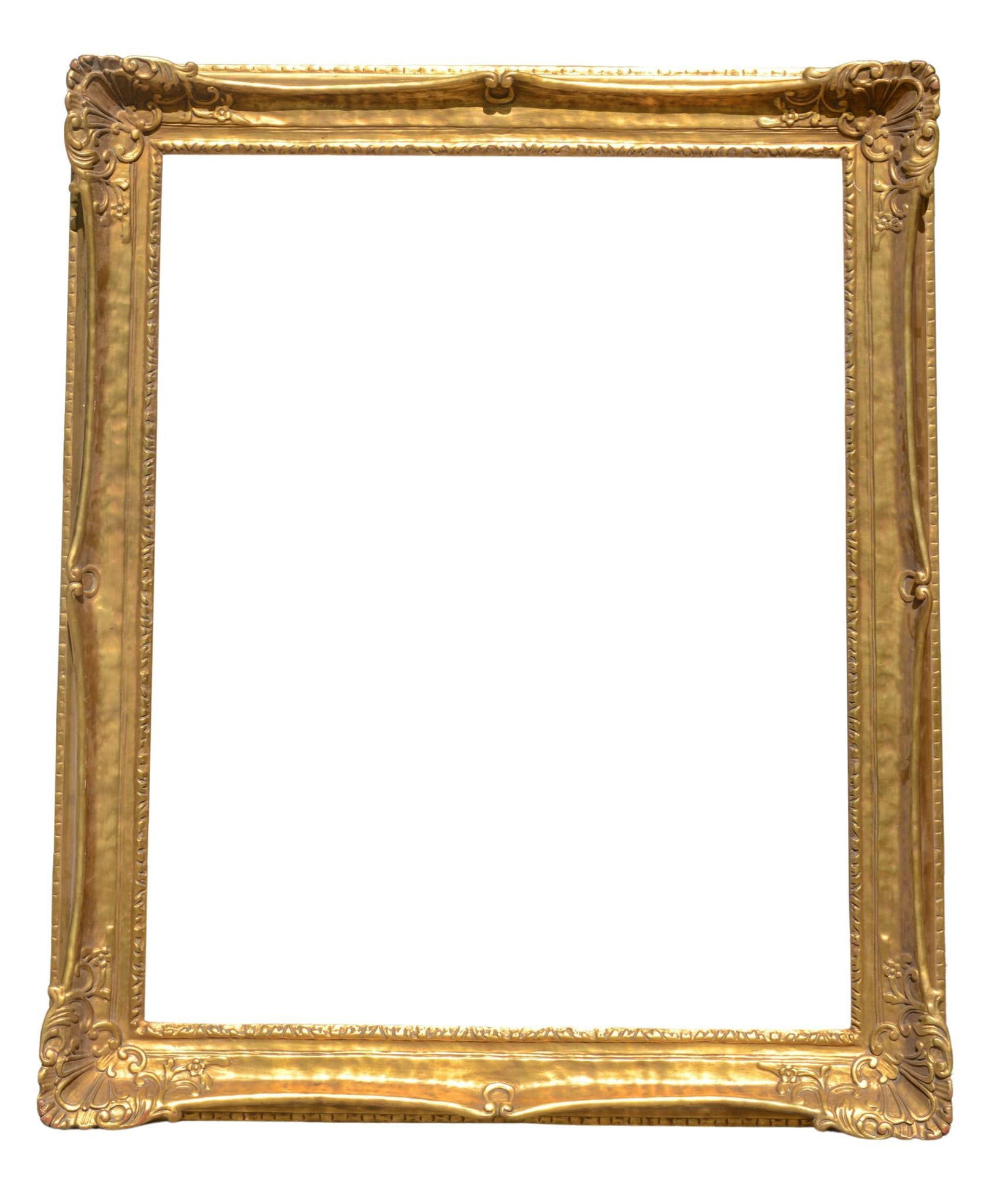 Large Carved Giltwood Frame.: Bevel 34.25 x 42.25 inches, overall 42 x 50 inches.