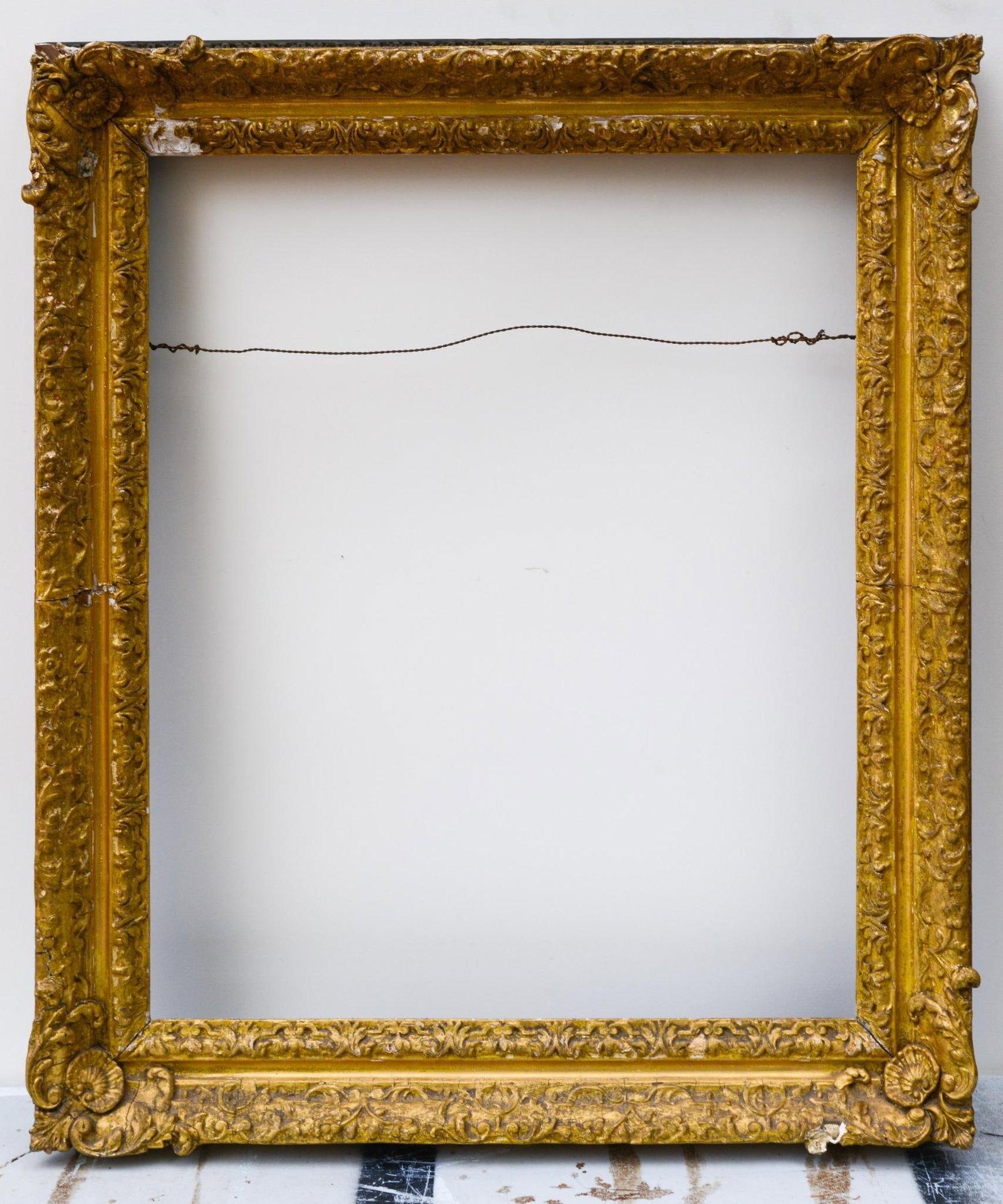 Large Antique Gold Carved Frame with Scrolls and Acanthus: Frame 37.5 inches x 32 inches, rabbet 31 inches x 25.5 inches, some loss to molding