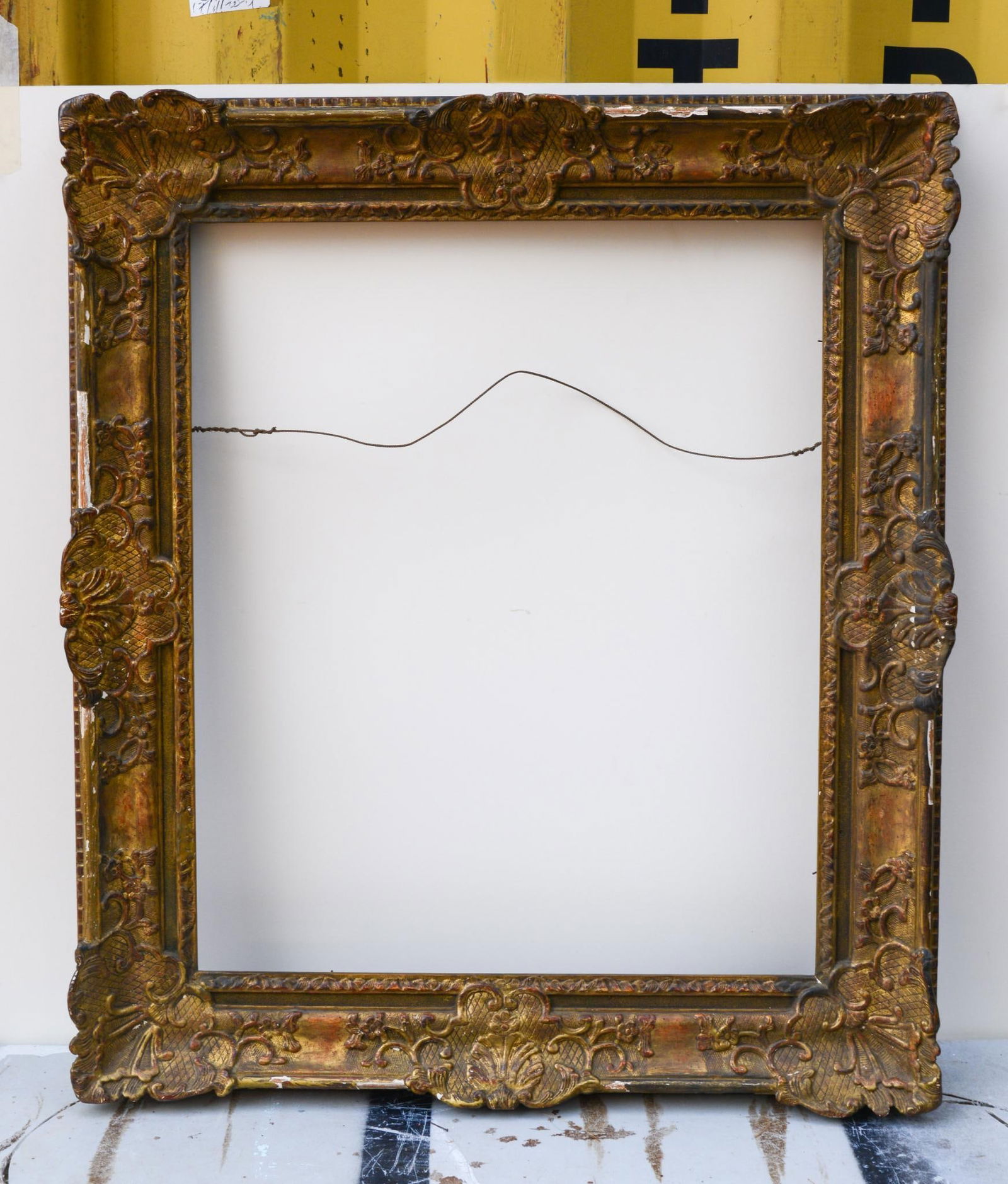 Antique Gold Frame Heavily Carved with Scrolls and Shells: Frame 39 inches x 34 inches, rabbet 30.75 inches x 25.5 inches, loss to molding