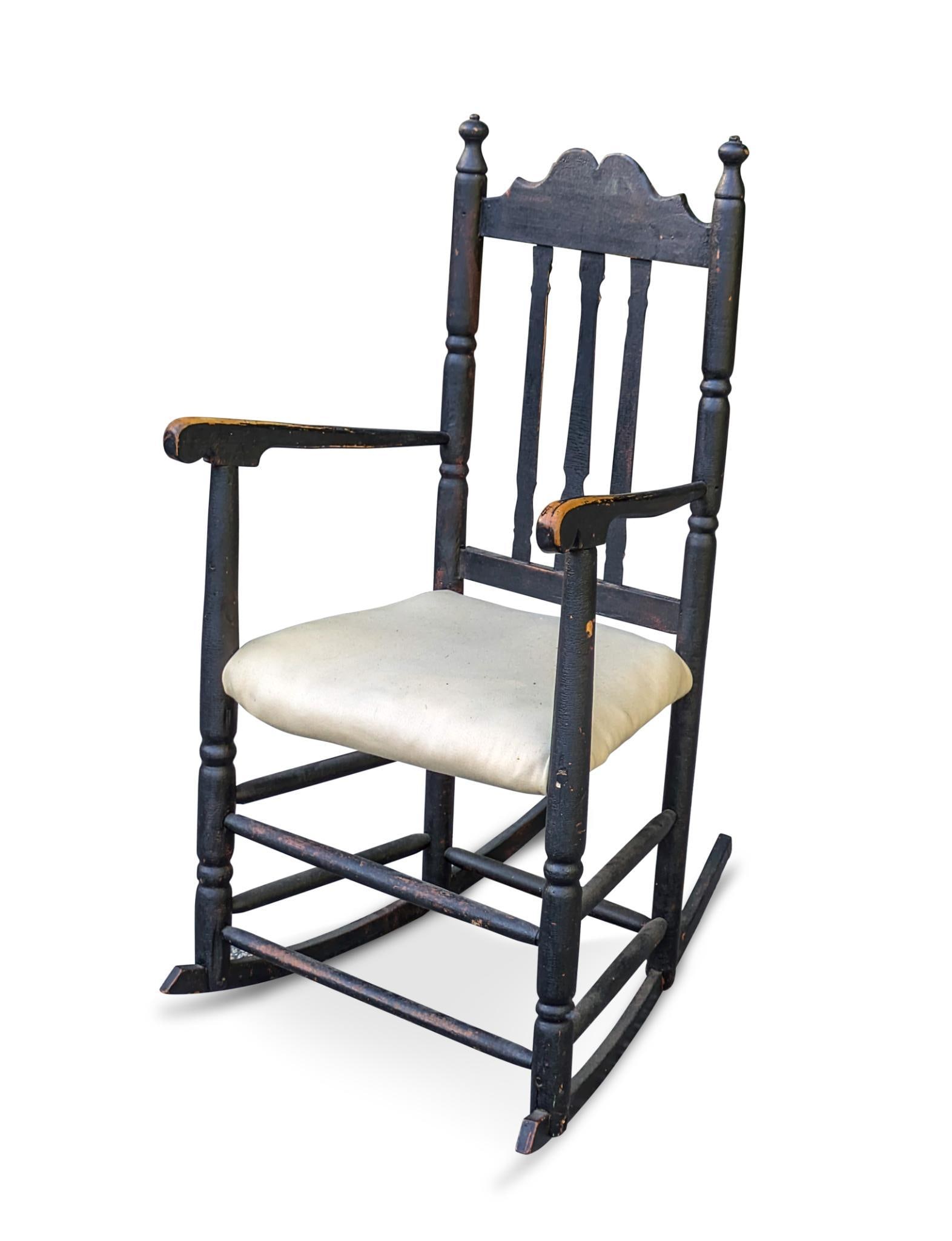 18th Century New England Rocker in Black Paint.: Seat height 20 inches, overall height 42 inches. Repair break to crest.