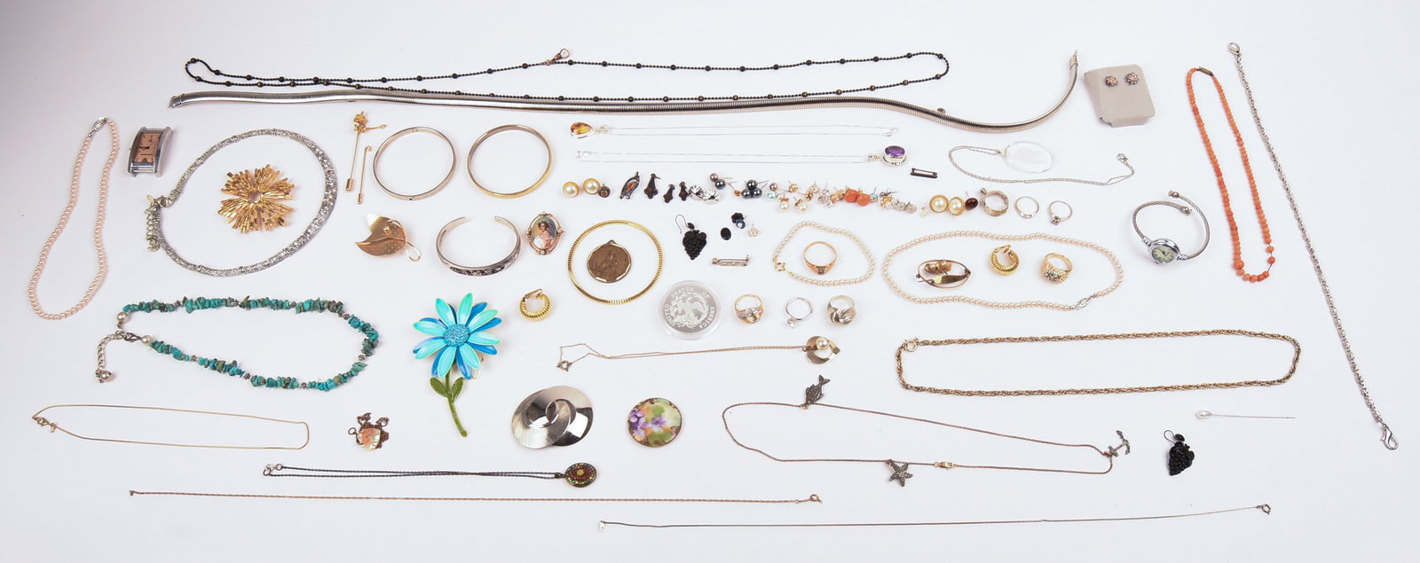 Collection of Costume Jewelry.: Earrings, watches, necklaces, and more.